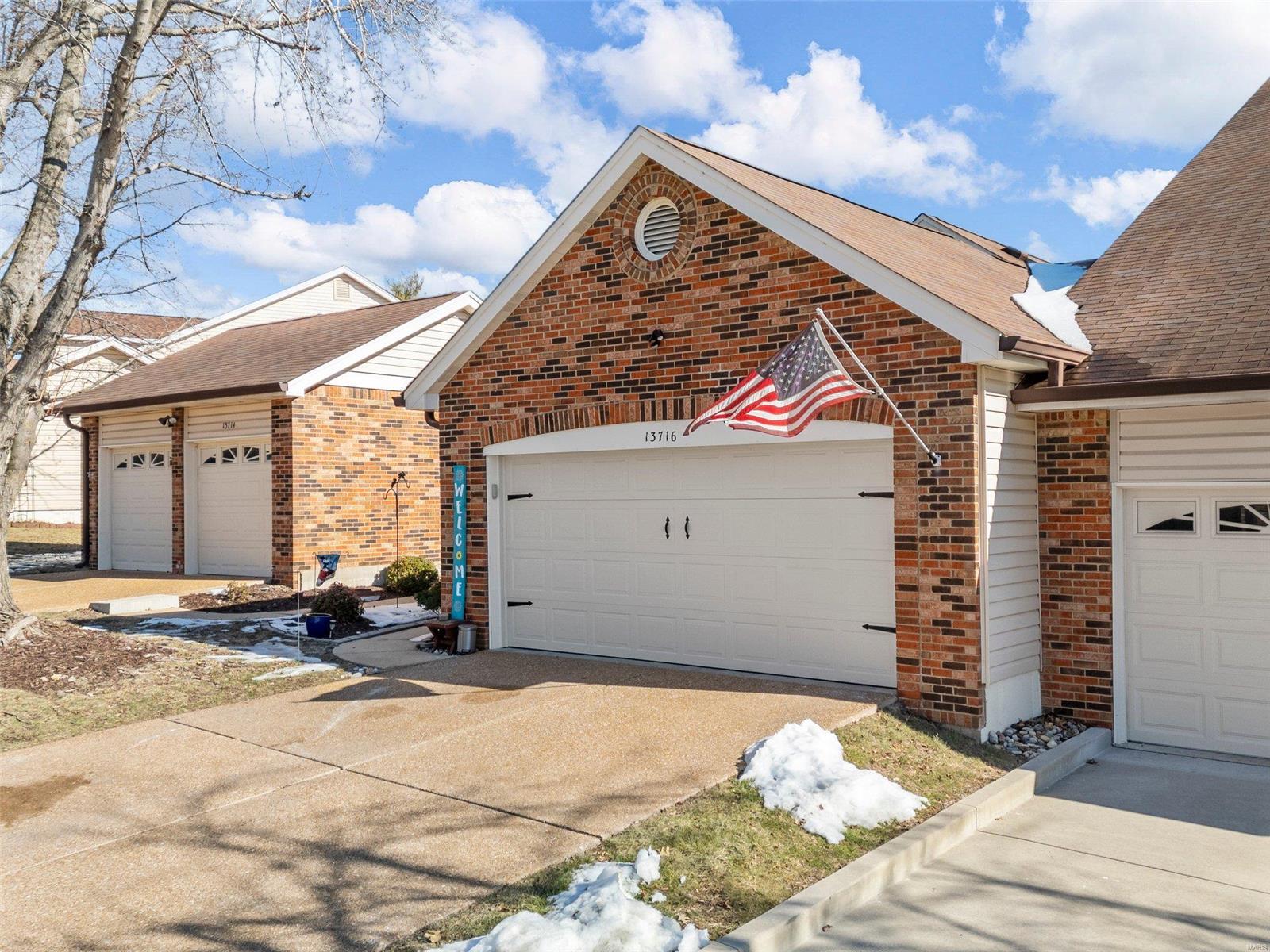 This stunning two-bedroom, 2.5 bath villa in South County offers the perfect blend of comfort, style and convenience.  The beautifully remodeled kitchen is a chef's dream, while the main floor laundry adds everyday ease.  The spacious two-car garage leads to a fully updated basement featuring a workshop and the ultimate setup for a sports fan-perfect for game days!  The lower-level walkout overlooks serene trees, lush grass, and the clubhouse pool, making it an ideal retreat.  Plus, you're just a short walk to the pool! Nestled in a quiet, friendly community, this one-of-a-kind villa is perfect for those looking for low-maintenance living with great amenities. Don't miss your chance to call it home! Additional Rooms: Workshop/Hobby Area Location: Ground Level