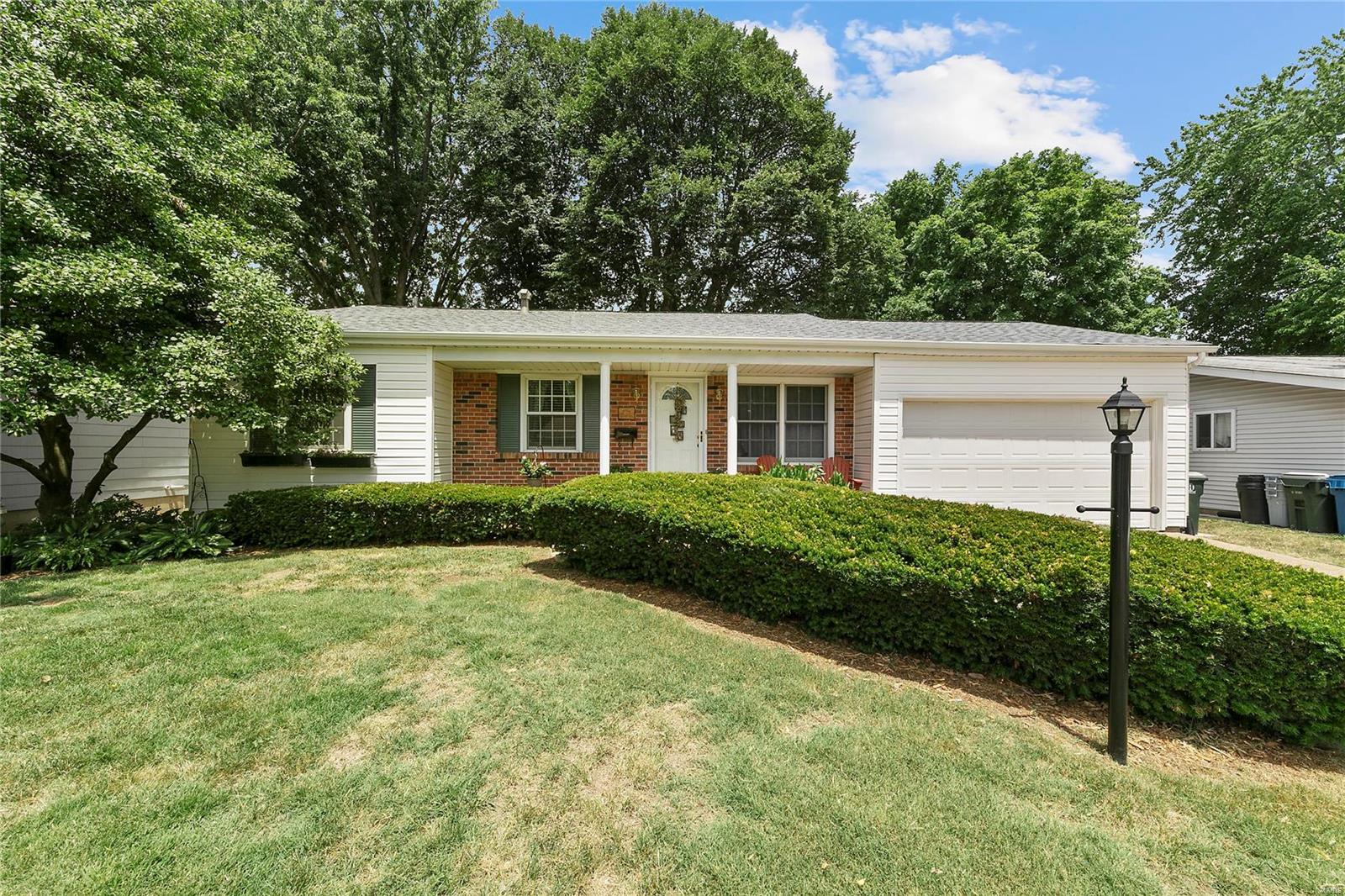 MOVE IN READY HOME IN HAZELWOOD! This 3 bdrm, 2 full bath ranch is clean and ready for you to call 'home'! NEW ROOF and curb appeal are exactly what you are looking for when driving up to your home. The tremendously oversized 1-car garage is perfect for covered parking AND storage! As you enter from the garage into the kitchen you will find ample cabinets, plenty of counter space and a nice eat-in area just off the kitchen on your way to the front living room. So much natural light flows in from the Andersen and Pella windows throughout. Although bedrooms are carpeted, underneath there is HARDWOOD ON THE WHOLE MAIN FLOOR. 3 generous sized bedrooms and a full bath finish off the main floor. Descend into your finished lower level that boasts another full bath, a sleeping area / bonus room, rec/family room and laundry room. Save the best for last...the level, well landscaped and shaded back yard is so inviting. Sit on patio and enjoy your lush oasis! MUST SEE TO APPRECIATE!