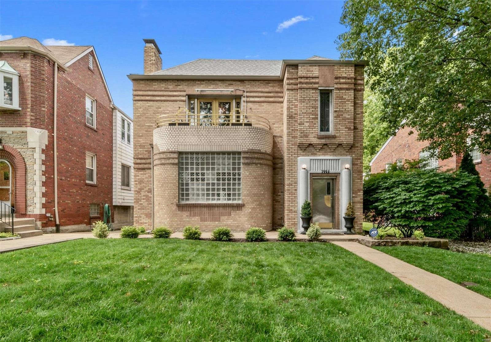 Incredible opportunity to own a historic Art Deco style 2-family building in a prime U-City location. Both of the spacious 3 bedroom, 2 bath units have been extensively restored and updated with a contemporary flair, blending well with the original architectural style of the building. The design of the buildings layout is unique as it offers an wide open floor plan with oversized bedroom and both with master suites. Features in unit washer/dryer, garage parking & storage for each unit. Property is turn key for an investor or perfect property for an owner occupant. First Showings begin Friday April 16th.