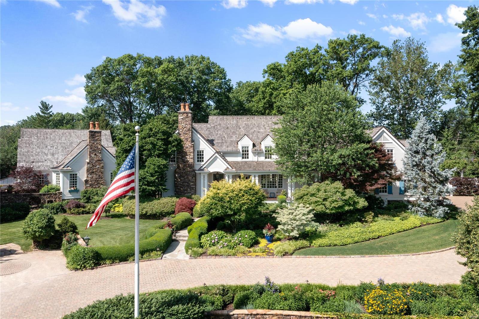 Opportunity awaits at this architecturally distinguished Grotpeter masterpiece in Town & Country, MO. The sprawling foyer connects to a warm den that flows to an art gallery with floor-to-ceiling windows & bar. Gorgeous walk-in wine room, custom moldings & Butler's pantry in the DR. The central eat-in kitchen boasts heart pine wood floors & La Cornue appliances & flows to the spacious breakfast room & hearth room w/ fireplace & relaxing views. An additional chef's kitchen offers plenty of prep space. The generous primary bedrm provides a fireplace & a private garden entrance. 2nd flr - 4 bedroom suites & a reading nook. Enjoy a gym, basketball court, wine cellar, & a full Irish pub in the LL. Outside, marvel at the immaculate grounds w/ spacious outdoor living spaces, pool,screened-in porch, rose garden with bistro seating, BBQ grills, pizza oven, vegetable gardens, small greenhouse, dog house, and generator. This is only a start to all the incredible features included in this home.
