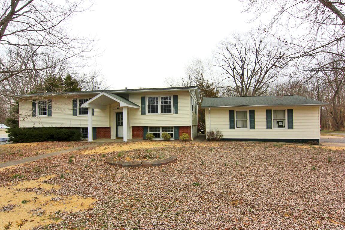 Spacious 4BR / 3BA home situated on corner lot. Offers walk out & detached 2 car garage. New flooring and paint throughout. Main level features 3 bedrooms & 2 bathrooms, formal dining, and living room. Lower level boasts a bedroom, full bathroom, and TWO separate family rooms.