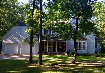 BEAUTIFUL & SPACIOUS 2 STORY HOME WITH 4 POSSIBLY / 5 BEDROOMS, & 3 1/2 BATHS.  LOVELY PRIVATE SETTING WITH 2.21 WOODED ACRES WITHIN WALKING DISTANCE TO THE GOLF COURSE.  DISPLAYS 2 FIREPLACES, A WONDERFUL KITCHEN/BREAKFAST AREA WITH NEW RANGE/DOUBLE OVEN WITH MATCHING STAINLESS REFRIGERATOR, DISHWASHER, & MICROWAVE.  THERE IS SPACE GALORE WITH A LARGE LIVING ROOM, FORMAL DINING ROOM, HEARTH ROOM WITH OFFICE AREA.  OFFERS LARGE MASTER SUITE AND GENEROUS SIZED BEDROOMS.  LOWER LEVEL HAS AN AWESOME FAMILY RM WITH SECOND FIREPLACE, REC AREA WITH WET BAR, LARGE BONUS ROOM WITH CLOSET COULD BE 5TH BDRM (NO WINDOW), AND A 3RD BATH.  RELAX ON THE OVERSIZED DECK WHILE WATCHING THE CHILDREN PLAY IN THE AMAZING TREE HOUSE.  THERE ARE PLAY, PICNIC, AND FIRE PIT AREAS IN THE LARGE YARD.  THIS IS A TREMENDOUS PROPERTY WITH SOMETHING FOR EVERYONE TO ENJOY.  COME VISIT THIS GORGEOUS PROPERTY SURROUNDED BY TREES AND NATURE AND JUST MINUTES FROM TOWN.
