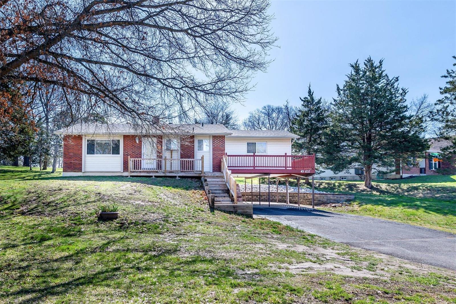Welcome home to this wonderful ranch home in the Marquette school district sitting on close to 1/2 acre. Home boasts nice floor plan on main floor including 2 bedrooms, full bath, hardwood floors in living room. Nice light and bright kitchen with eating area. Bonus room addition off the kitchen is a multi purpose room (Dining room, game or media room... seller had his pinball machines in it) which walks out to the deck. Lower level has additional bath, walk out, famliy room and storage/work shop area. Patio area out back with attached storage shed/work area. Seller prefers and as is sale, but buyer will be allowed to do their own inspections.