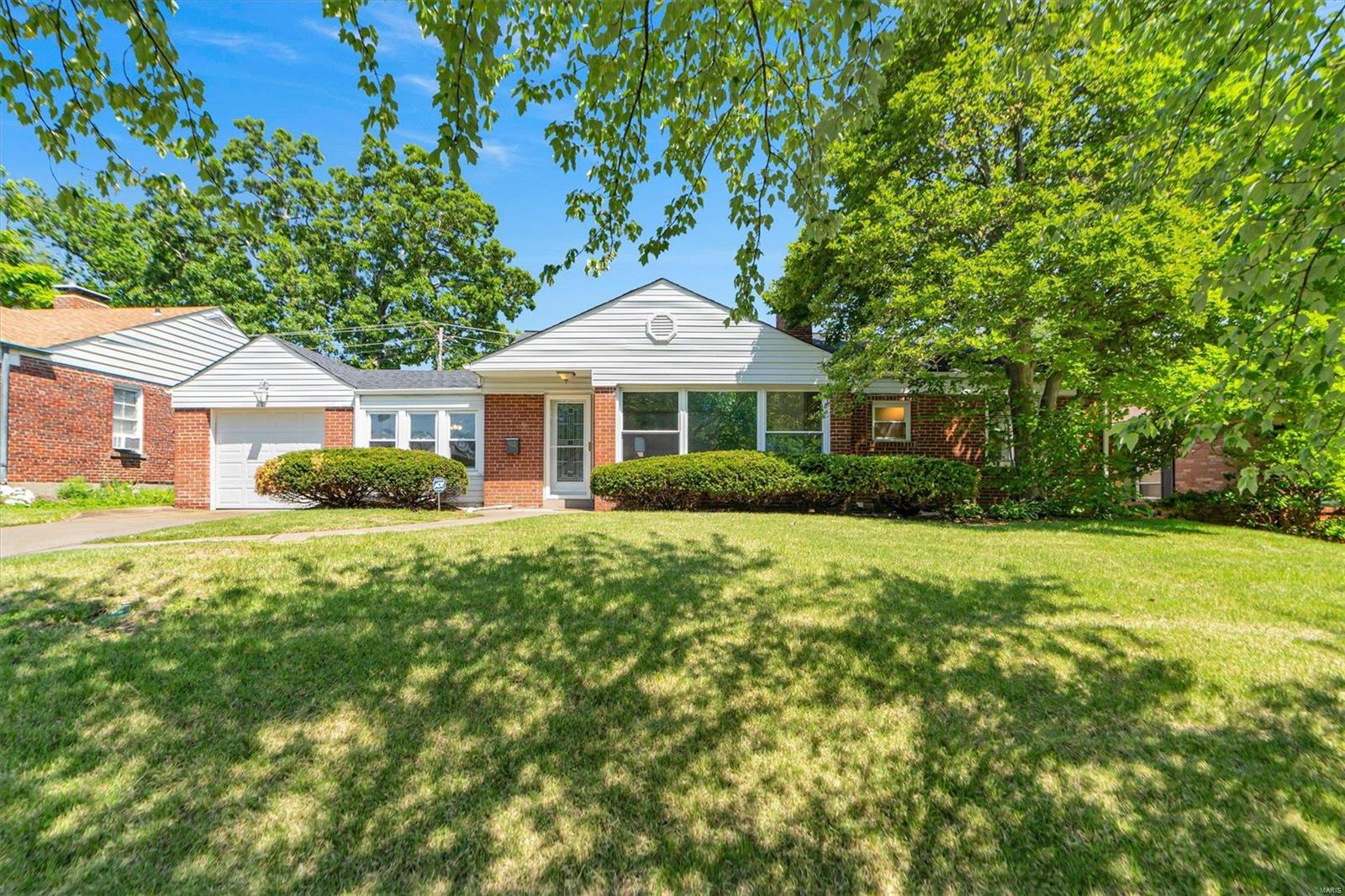 STUNNING 4 bedroom, 2 full bath all brick home in highly sought after University City subdivision minutes away from downtown Clayton! Pristine move in ready home has over 1,900 sqft of livable space and has tremendous curb appeal. Be amazed the moment you walk through the door with spectacular hardwood floors and large picturesque windows for plenty of natural sunlight! Features and updates include: custom kitchen with exquisite granite countertops, glass mosaic backsplash, stainless steel appliances, custom main floor bathroom, wood burning fireplace, separate dining and paint. Finished lower level has walkout, recreational/game area, additional bedroom, full bath, laundry and storage area. Level fenced in backyard has large patio perfect for entertaining or enjoying nice summer evenings. Minutes away from Ruth Park Golf, St. Louis Art Museum, the Muny, Washington University, restaurants, shopping and much, much more! Make 912 Gay Drive YOUR home TODAY!