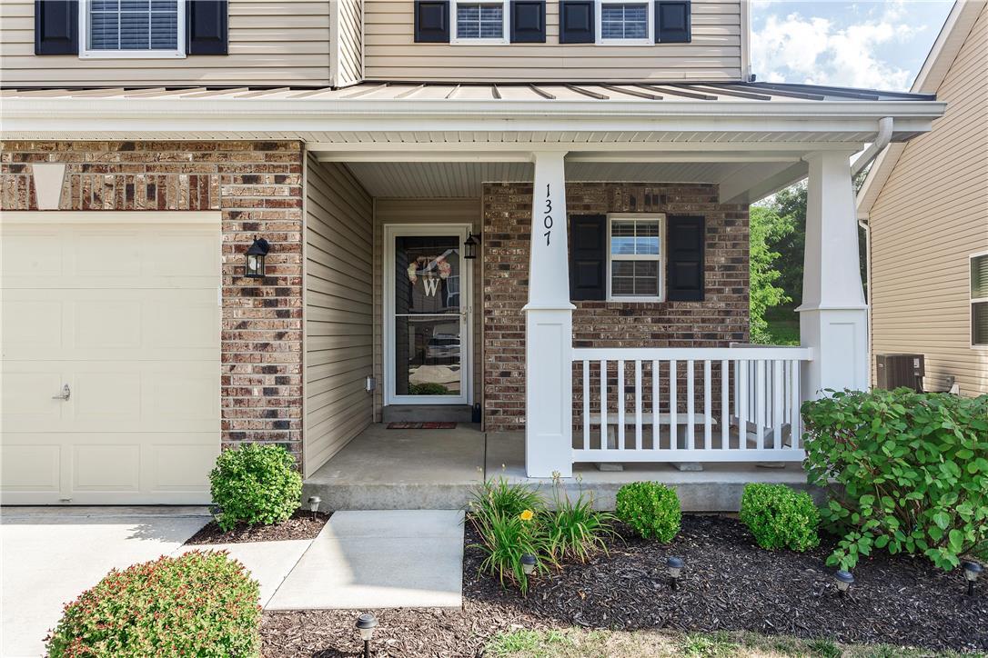 Absolutely charming townhome in desirable Crossings at Hyland Green; this three bedroom / 2.5 bath beauty boasts fresh & almost "still new" everything! Built w/ integrity & many builder upgrades too as selected by this thoughtful original homeowner.  Wait till you see the wonderful "wood" floors & upgraded carpet, light fixtures & ceiling fans too! Main floor spacious family room  opens to great over-sized eat-in kitchen w/ custom cabinets, solid surface counters & sleek black appliances; walkout from here to the patio & ample back yard for those al fresco dining moments too! Two large full baths AND a first floor powder room here; a spacious master bedroom & full en-suite bath & a great walk-in closet too; two supporting bedrooms w/ generous closets; plus a second floor laundry. Lower level is yet unfinished but also awaits future possibilities with egress & a potential third full bath! Great neighborhood with a community pool, perfect for your starter home OR downsizing, THIS IS IT!