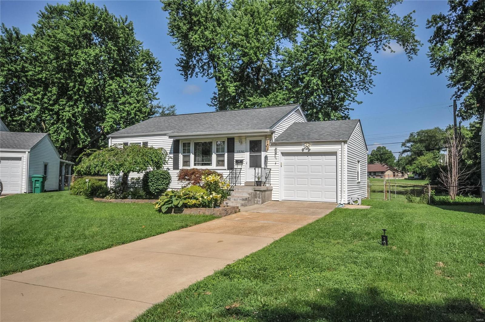 What an absolutely charming home you'll find here.  Well maintained is an understatement.  Beautiful landscaping on a large, level yard is a great first impression.  Nice sized rooms, 2 beds with gorgeous hardwood floors, crown molding in front room with large window, updated bath and truly a gem of a kitchen with just the right everything.  Toss in a nice backyard with big trees and fencing plus storage building and you have a great home in a quiet corner of town.  Plan to visit soon. We welcome you and we thank you.