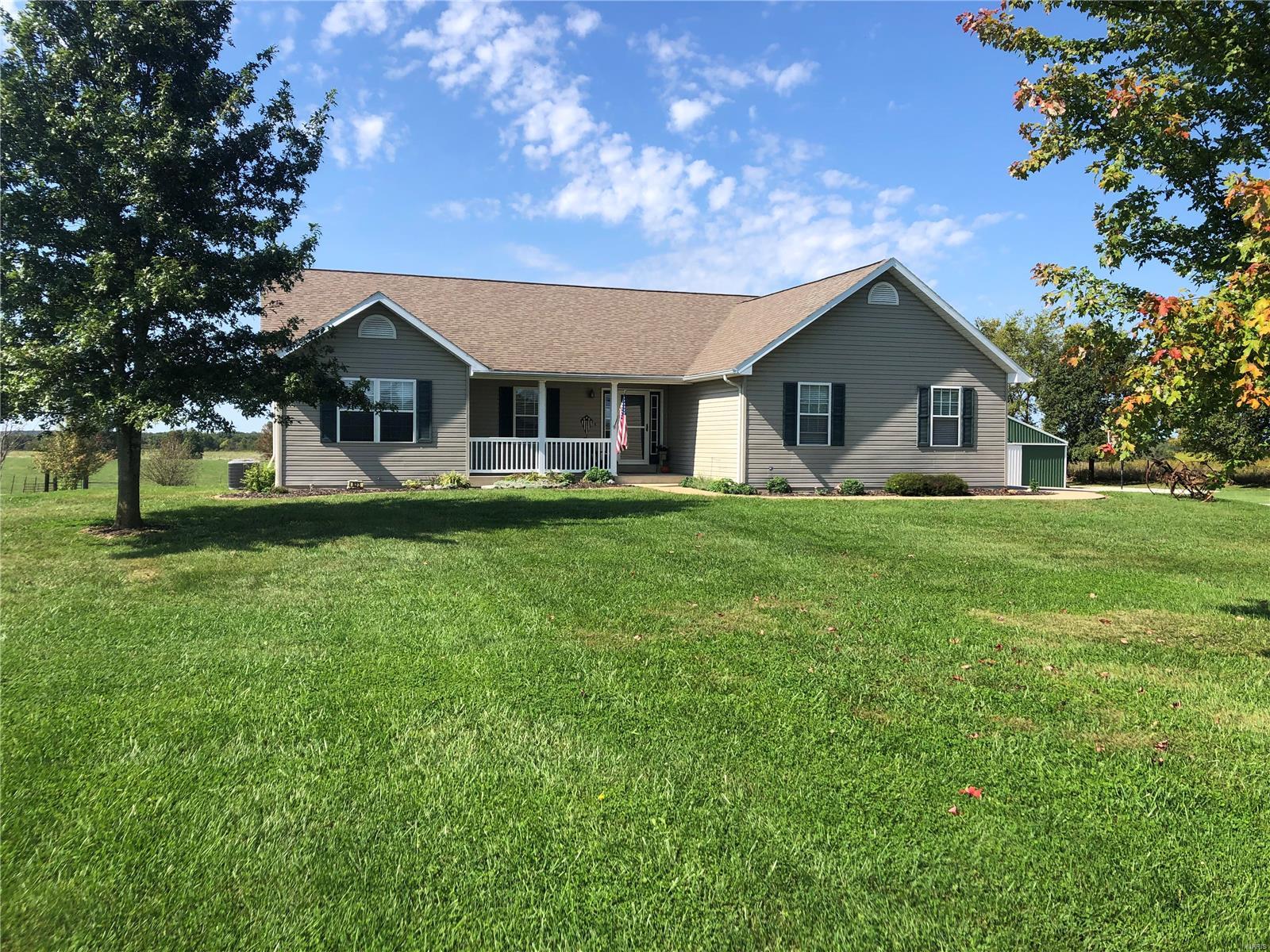 Too Good to be TRUE! Beautiful ranch home located on 14 acres m/l in Southern Lincoln County. Pride in ownership and a one owner. Home features 1830+/- sq.ft. on main level w/open concept, large living room w/brick wood burning fireplace and vaulted ceiling. Large kitchen with tons of cabinets, pantry and dining area with view of property. Main floor laundry/mud room, 2 guest bedrooms and full bath. Spacious master with large walk in closet and large master bath. Basement is a 9' pour with rough in bath, guest bedroom, plenty of storage and room for the kids and a walkout. The home was custom built by Henke Construction. Enjoy the large covered patio and the deck. The outbuilding is 57'x72' with electric, 220 plug, gravel floor. Plenty of storage for equipment, hay or toys! Property is fenced into 2 paddocks with 2 hydrants & loafing shed. The location and the setting doesn't get much better. Minimal deed restrictions: no junk yards, no single or double wides or manufactured homes.