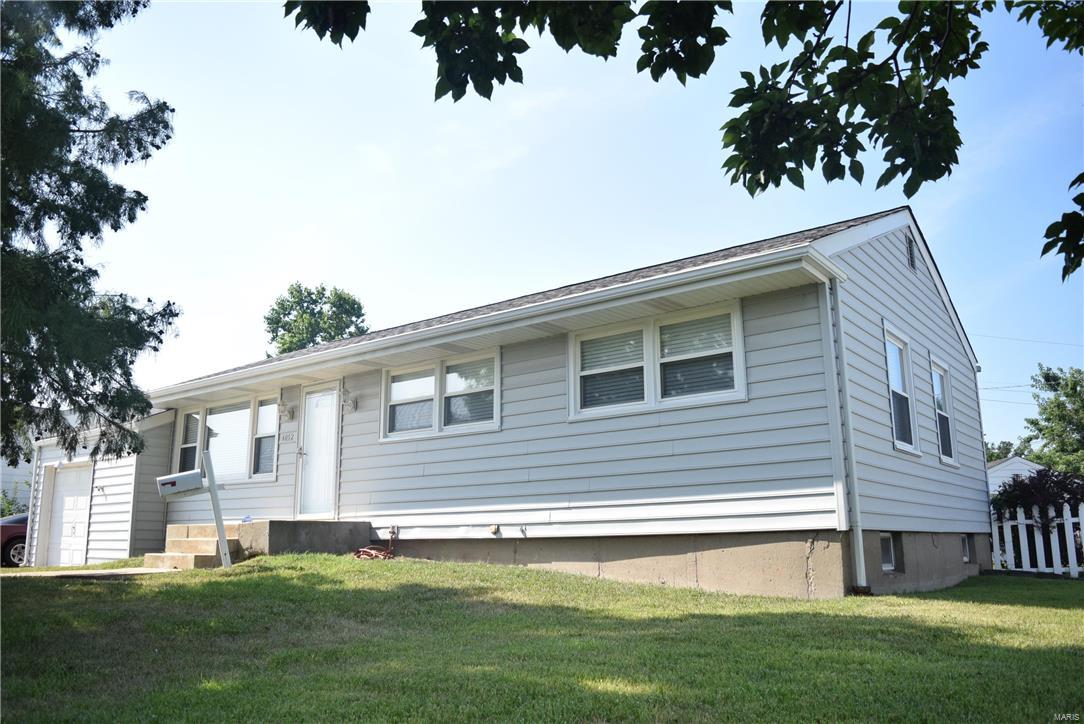 Tons of updates, pride of home ownership and convenient city location are just a few of the home's many wonderful features. Exceptionally renovated kitchen boasts high-end maple cabinets w/ crown molding, beautiful tile backsplash, granite counter tops w/ breakfast bar, and newer white appliances including dishwasher!  The bathrm has also experienced a full renovation w/ tile floors, ceramic tile surround, new vanity & new commode.  The main level is complete with 3 bedrms (one of which has two closets), an open floor plan between the kitchen, dining room & family room, some newer windows, some newer light fixtures, ceiling fans, faux-wood blinds plenty of extra closet space, and direct access to the backyard patio.  The truly unique and differentiating characteristic is the oversize garage measuring at 28'x14', perfect for extra storage or workshop.  Recently refinished hardwood floors, full/dry basement, new sewer stack, new lateral and new roof complete this move-in ready home!
