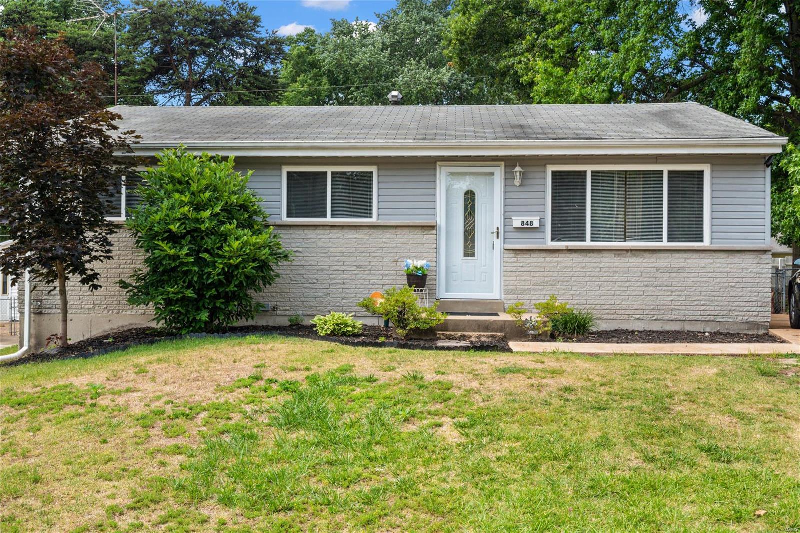 Welcome home to this spacious three bedroom ranch home with finished basement.  Upon entry you're greeted by the large living room leading you into the recently redesigned kitchen.  The kitchen features stainless appliances and updated cabinetry. The basement features a large rec room area which includes a bar. The all new carpet and additional room in the basement, which could be used as an office or sleeping area, gives this modest home the flex space to feel comfortable on either level.  Lastly this home has large fenced backyard which backs to a park for you to enjoy.