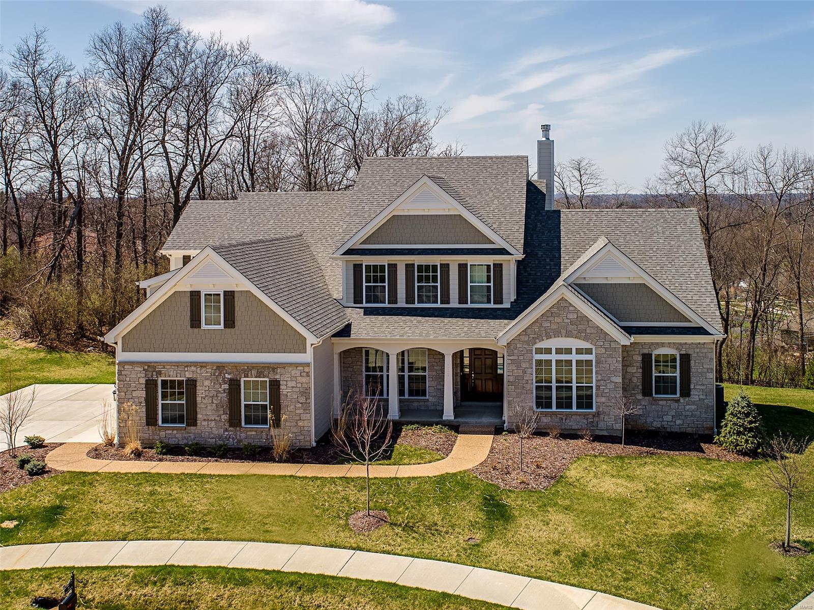 Spectacular 1.5 story by Prestige Custom Homes on a large walkout homesite on cul-de-sac in Belle Maison subdivision.  This 4 bedroom, 3.5 bath, home features a 3-car side entry garage, outdoor room with fireplace and vaulted ceiling, job stained hardwood flooring, gourmet kitchen with custom cabinetry, crown molding, soft close drawers, granite countertops, Kitchen-Aid stainless steel appliances, under cabinet lighting, built-in lockers, and impressive hearth room with vaulted ceiling and stone fireplace.  Soaring 2-story great room offers a fireplace, wood beamed ceiling, hardwood floors, wet bar with beverage coolerand wine rack,  study with vaulted ceiling built-in bookcases. Elegant master bath suite boasts coffered ceiling, separate walk-in closets, adult height vanities, stand alone tub,and vaulted ceiling in master bath.  Other amenities include a expansive 2nd floor bonus room. Additional Rooms: Mud Room