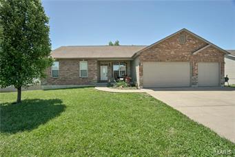 Beautiful brick & stone elevation, oversize three car garage, level yard and brick mailbox give this ranch home excellent curb appeal. As you enter this home the first thing you will notice is the spacious open floor plan, 9 foot ceiling and hardwood flooring spanning through out most of the main level. The great room offers a gas fireplace and ample space for entertaining guests. The custom built kitchen features cherry cabinets with crown molding, granite counters and complimenting tile back splash. The master bedroom suite offers walk in closet and adjoining master bath with double sink. The finished walk out lower level offers additional living space with large family room, built in entertainment center, 2 additional bedrooms and a full bath. This home is sure to please!