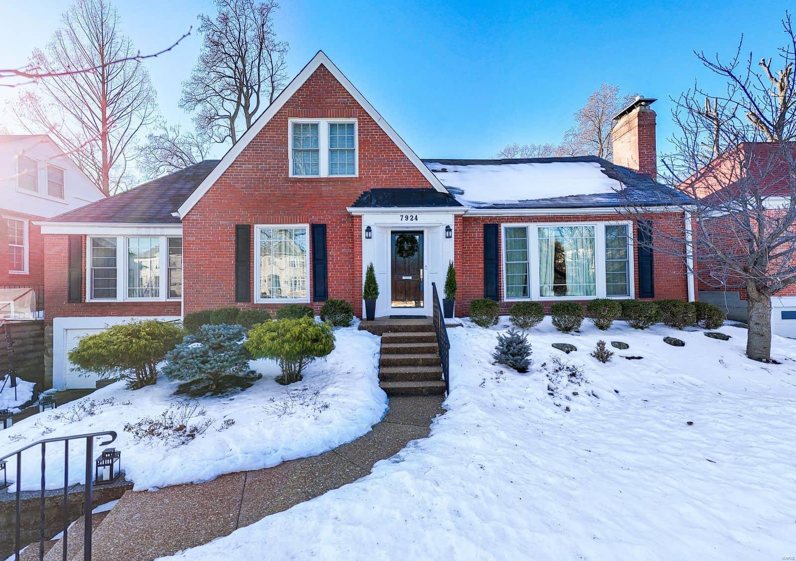 Historic charm & modern updates combine in this completely reimagined 1946 home. This classic University City brick charmer has been cleverly reimagined with an open central living area & perfectly tucked away bedrooms, including a main floor primary suite. The bright kitchen anchors the main living space, featuring a large center island, sophisticated granite countertops & backsplash, crisp white custom cabinetry & loads of storage. Open to the living & dining rooms the central space is built for gathering with a gas fireplace with stone surround, & access to the professionally landscaped yard. The main floor primary suite offers a modern bathroom with separate vanities, separate whirlpool tub & shower, & walk in closet with custom storage. A den with wood burning fireplace & updated powder room round out the 1st flr. Upstairs find 3 additional beds with loads of closets & built in storage. The large updated 2nd floor bath includes double sinks, separate shower & laundry. Do not miss!