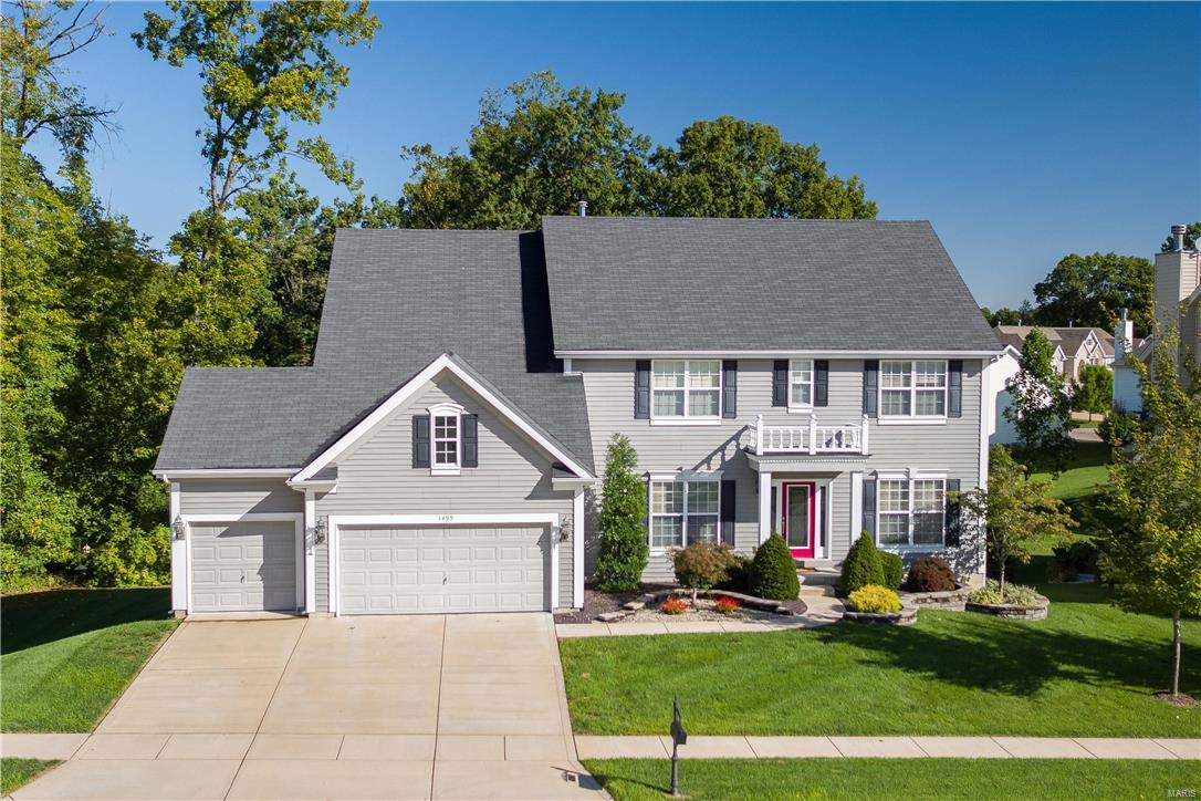 Incredible expanded 2 story home is decked out w/special amenities and upgrades and generous room sizes on 3 levels of finished living space. The main floor entry opens on either side to formal dining and living areas and leads to a large greatroom w/woodburning fireplace. The open floorplan has a large breakfast room w/walk out to the deck overlooking the private backyard setting. The gourmet kitchen boasts white 42" cabinets, custom center island, granite surfaces, walk-in pantry, & adjoining floor laundry. Glass doors open to a home office (or or could be used as 5th bdrm). Upstairs, you'll find a large family room area along w/4 generous size bedrooms all w/walk-in closets. Master suite has luxury bathroom & huge walk in closet. 2 bdrms share jack 'n jill bath, while the 4th bdrm has private bath. The finished lower level provides a large rec room w/wet bar, theatre room, exercise area, half bath, storage & walks out to the patio. AAA Rockwood schools & convenient area!