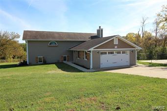 Here is your opportunity for an updated 3+ bedroom home with an oversized 2 car garage sitting on 3+ acres.This home is ready to be enjoyed by its new owners!Updated kitchen with stainless steel appliances, granite counter tops, breakfast bar, tile floor and pantry.Covered deck off of the breakfast room leading to the backyard where you have a shared pond.Wood floors throughout most of the main level except for the bedrooms which are carpeted.The home also features an open floor plan, newer lighting, fresh paint, 6-panel doors.The bedrooms are sizable and have walk-in closets.The master bathroom is updated with double vanities and tile shower.Two other full bathrooms are updated as well.The LL is finished with a spacious family room with wood burning fireplace and french door leading to the patio.There is also a bedroom, bathroom, storage, mudroom and a nice sized laundry room with cabinets and sink.Outside is a fenced courtyard to play in.Seller is offering a one year home warranty. Additional Rooms: Mud Room