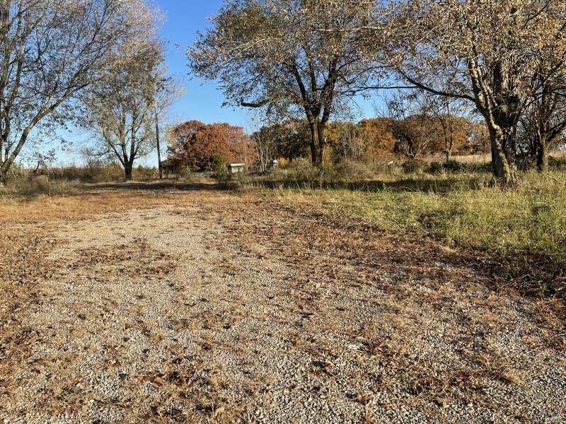 Versatile lot, only a mile from Grovespring, MO. 20 miles to Lebanon and 20 miles to Marshfield. Fenced on two sides,
this land has a large slab for a shop building or business already in place. There is 3 phase power available should you want to open a business that needs this kind of power.  Power is running 5.5c/kWh from the nearby substation which has 10MW of available power. There was a home and a mobile home, which were torn down but the wells (3 total) and possibly septics are still in place. Seller does not know if these still function. There are a few trees to provide some cooling and privacy, but enough open space to utilize it for a number of things; hobby farm, gardens, greenhouse, business buildings, storage buildings, homes, rental homes, whatever you want. This property consists of two lots to be sold together.