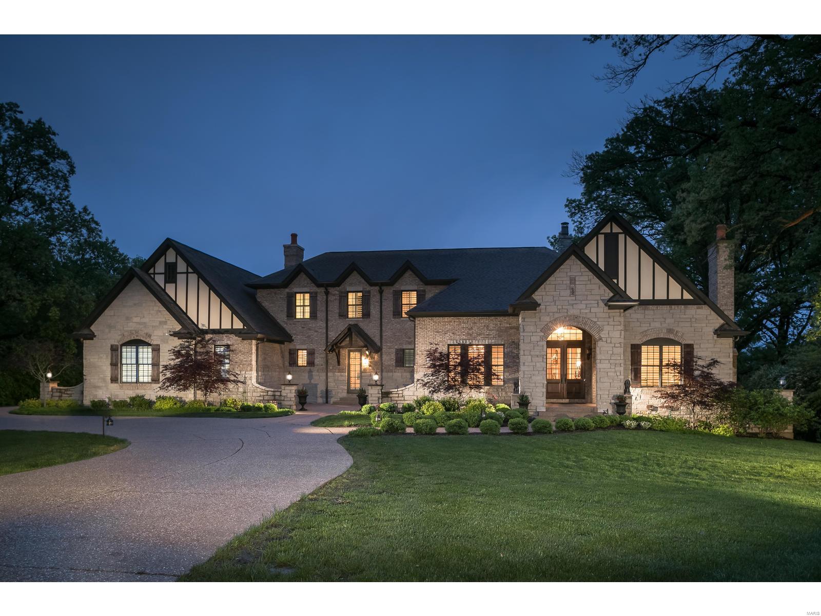 Five/Six year old brick & stone English country home handsomely set on just shy of 1 acre. Ladue Schools. 4 bedrooms, 4 full bathrooms & 3 half baths. Approximately 5,500 sq. ft. Custom features include gorgeous 3 tiered crown moldings, robust millwork on interior archways and walls; 3 fireplaces, 10’ & 12' ceiling heights on the main level & 9' on 2nd fl. The SIGNATURE ROOMS: Main floor Master suite w/a large walk-in/organized closet; luxury bathroom w jet tub, large walk-n shower and heated stone floors; Chef's Kitchen w/Viking Professional appliances, Omega Dynasty high-end cabinetry & thick granite counters. Large island seats 3-5; Breakfast rm w/great natural light; Hearth rm w/glass doors that open to the covered lanai, landscaping around the in-ground pool & gorgeous back yard. Outdoor cooking area & fire pit. The 2nd fl has a large family rm; 3 bedrooms w/private baths & walk in closets. Finished LL rec areas w/half bath. Space to expand. 4 car oversized garage. Circle drive. Additional Rooms: Mud Room