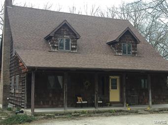 Magnificent 5 bedroom home. This home sits in the center of 35 wooded acres and feels secluded yet is still close to everything. Recently remodeled this home is ready for your large family. Two full levels with a loft that adds so much potential for a home office,
game room, man cave or just a quiet get away space. There is a large laundry room and a second room off the kitchen that could serve as an extra dining room for large occasions or as another sitting area. There is also a full basement that has an additional wood furnace that can easily be changed from the new gas furnace to a wood heated home.  This property has no equal in the area and will not last long. Please call today!