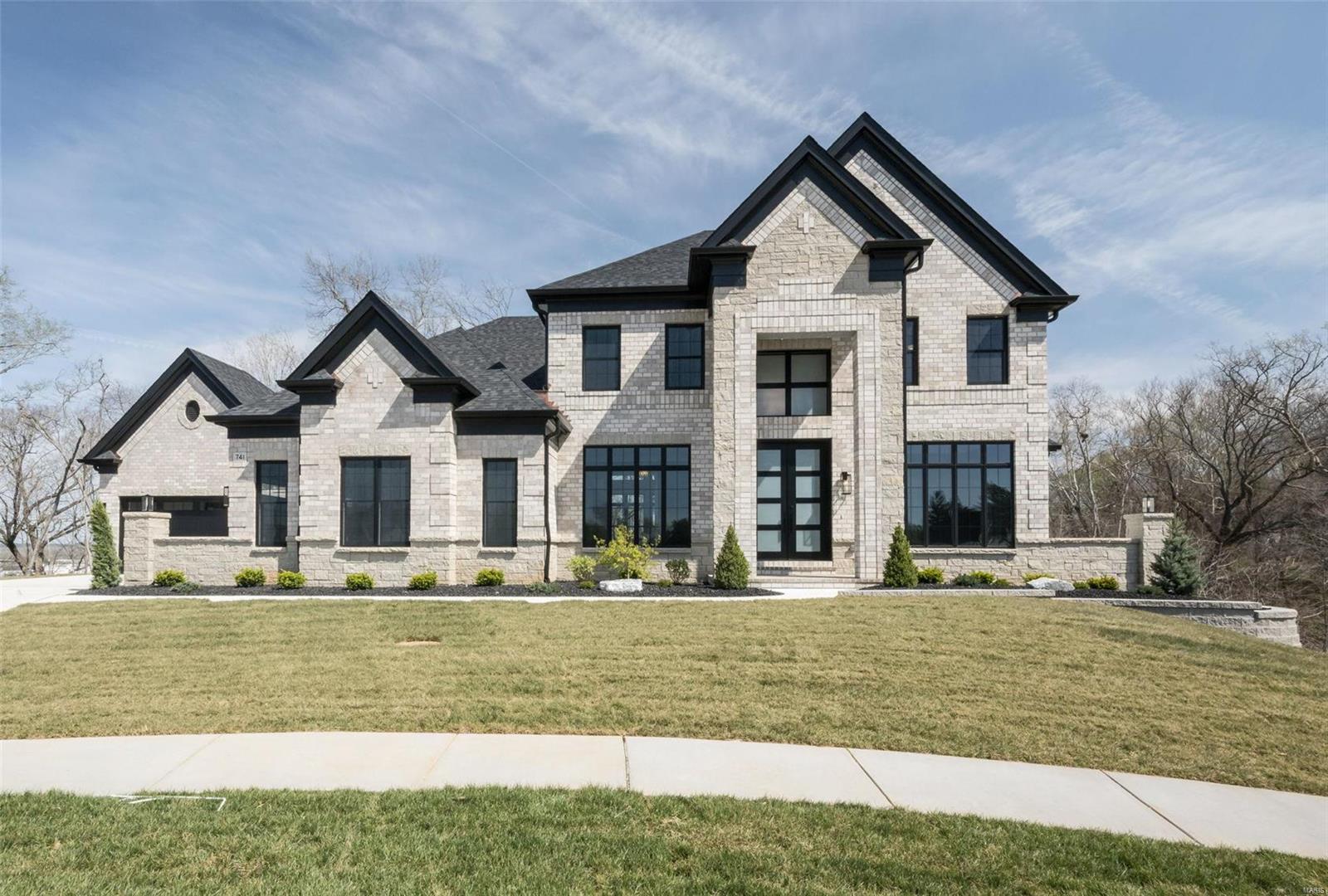 New Construction, Chesterfield, Rockwood Schools! MAGNIFICENT 1.5 Story home w/ Finished Lower Level in a FABULOUS LOCATION! Crafted by St. Louis' premier hands-on builder, Claymont Development, LLC - Wesley Byrne. The WINGATE III is a spectacular 5BR, 4.5 bath w/ 5400 sq ft of exquisitely finished living space. Exterior features a warm blend of brick & stone; extensive millwork; Two-story entry foyer makes a striking first impression! Formal dining room w/ wainscoting & den/office on either side of the Foyer; two-story great room w/ gas fireplace, built-in shelving. Huge gourmet kitchen features custom cabs, granite counters & 9-ft island! Luxury owner’s suite w/ dual closets. Three bedrooms, two baths, & bonus room complete the upper level. 10' main floor ceiling, 8' doors, 4-car garage; Screened-in porch & deck overlooks common ground! Sensational LL includes brick/stone wet bar, huge rec-room, 5th bed, & full bath. 4 different models total! Tour is of the Display Home.