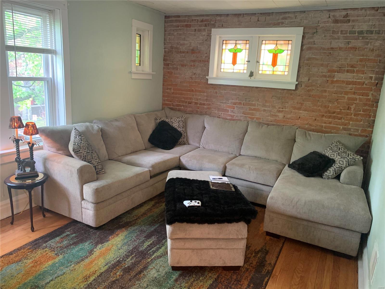 ** 1st floor long term tenant 2nd floor - Fully renovated. Exposed brick walls. Entire property has hardwood floors refinished and two bedroom units in nice/convenient location, 15 minutes away from SLU & 20 minutes from Wash U. Walking distance to two different parks, on a beautiful tree lined-one-way street. Property boasts w/ hardwood floors, luxury vinyl tile in the kitchen, freshly painted, updated kitchen: newer gas stove/oven, refrigerator, ceiling lights/fans, newer butcher block counter top, modern sink, dishwasher, newer faucets, & some updates in bathrooms w/ ceramic floor & new vanity/faucet. Washer/dryer included for each unit. Wonderful architectural features, stained glass windows, full walk-out lower level w/ newer cemented walls, storage area. Close to restaurants, stores, shops & amenities. Perfect investment property that runs itself w/o a lot of maintenance needed OR Perfect for owner occupied in one unit and reap the rewards of a solid tenant providing income. **