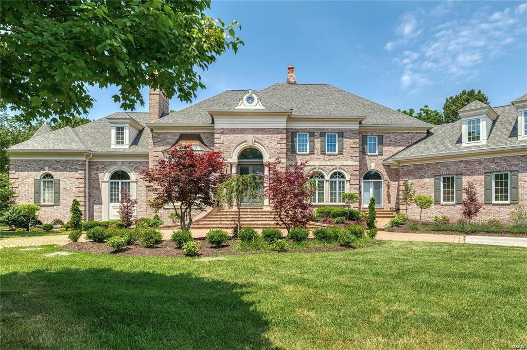 Exquisite and TIMEless best describe this Luxury estate on 1.2 acres in the heart of St. Louis.  Built by DeJenney and Desiger Churck Brandt--- nothing was left undone. Architectual Molding is beyond belief. 18 ft tall curved wall of windows  with remote shades in Great Rm. (also curved wall Family in Room Welcome gorgeous sunsets. Dont miss out on this one of a kind Luxury with *5 bedrooms, 7 Fireplaces & Seven Baths. Over 7000 sqft finished on 2 main floors plus 4000+ on walk-out Lower Level. Covered patio  with Wood Burning Fireplace off the Family /Breakfast area. Two walk up Entertaining Bars on main and Fantastic full service Entertaining Bar area with Refrigerator & cook top area in Lower Level. Don't miss Home theatre w custom designed /glass etched windows. Two Fireplace areas on this level. Lovely Spa style full bath w Steam shower adjoins BR. 4 car garage has custom floor & built-in storage cabinets. Classy Circle drive with inlaid brick sections. Bonus room over the garage!