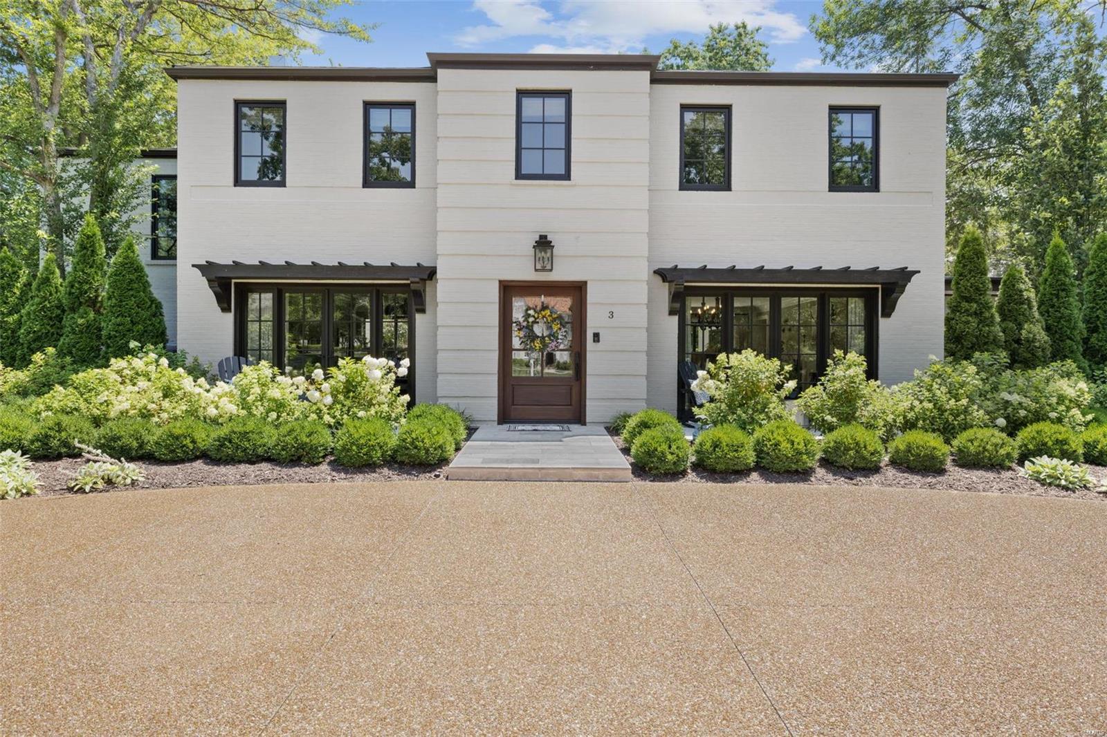 Introducing a magnificent luxury listing in sought-after Ladue. This exquisite home boasts an impressive Tuscany flair, offering unparalleled blend of elegance, comfort, and style. Every corner has been meticulously designed to showcase the finest craftsmanship and attention to detail,  The gourmet kitchen is a chef's dream, outfitted with top-of-the-line appliances, custom cabinetry, and elegant countertops. Kitchen is equipped to handle any culinary endeavor. open layout for seamless flow into the adjacent dining and living areas for an ideal space for entertaining guests. The back family room offers cozy fireplace and wet bar. two multi track sliding glass doors open up to outdoor oasis with patio and fenced in landscaped back yard with electronic gate. Owners suite with luxury bath and huge walk in closet and 3 additional bedrooms, main floor laundry, newer Loewen windows and doors/HVAC/Water heater/boiler/driveway. and radiant flooring heating throughout.  photos will be  7/5