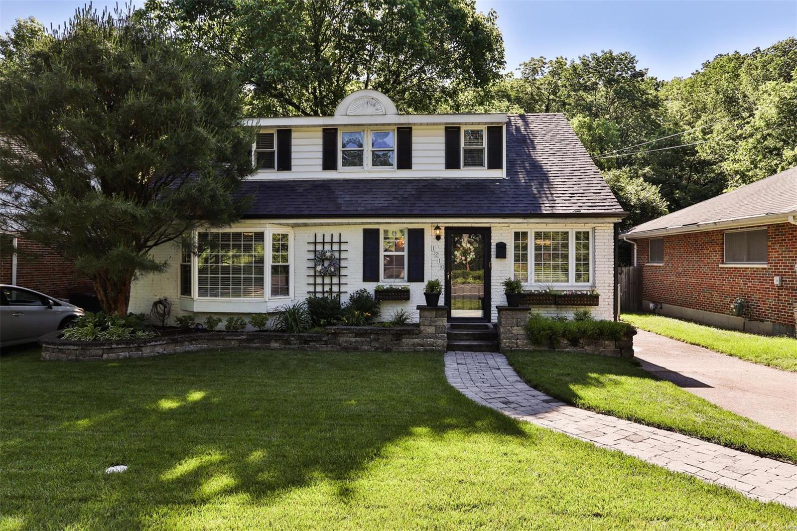 Welcome home to 1210 Des Peres! WOW - this adorable 4 bed / 1.5 bath home in Webster Groves is truly a gem! You're drawn in by the beautiful curb appeal. Step inside to the open concept living room & kitchen. The natural light from the abundance of windows and skylights fills the home! The living room features wood floors, a gas fireplace, and a dining area. The kitchen offers a center island, electric cooktop, some glass front cabinets, and granite countertops. On the main floor, you'll find the master bedroom, a second bedroom, and a full bath. Head upstairs to the third and fourth bedrooms, currently being used as a generous sized office and guest bed. Entertain your guests in the partially finished basement with a rec room, built-in bar, and half bath! Looking to entertain outdoors? This large fenced in backyard is complete with a patio and fire pit area for those cozy bonfire nights! This home won't last long...Schedule your showing today!