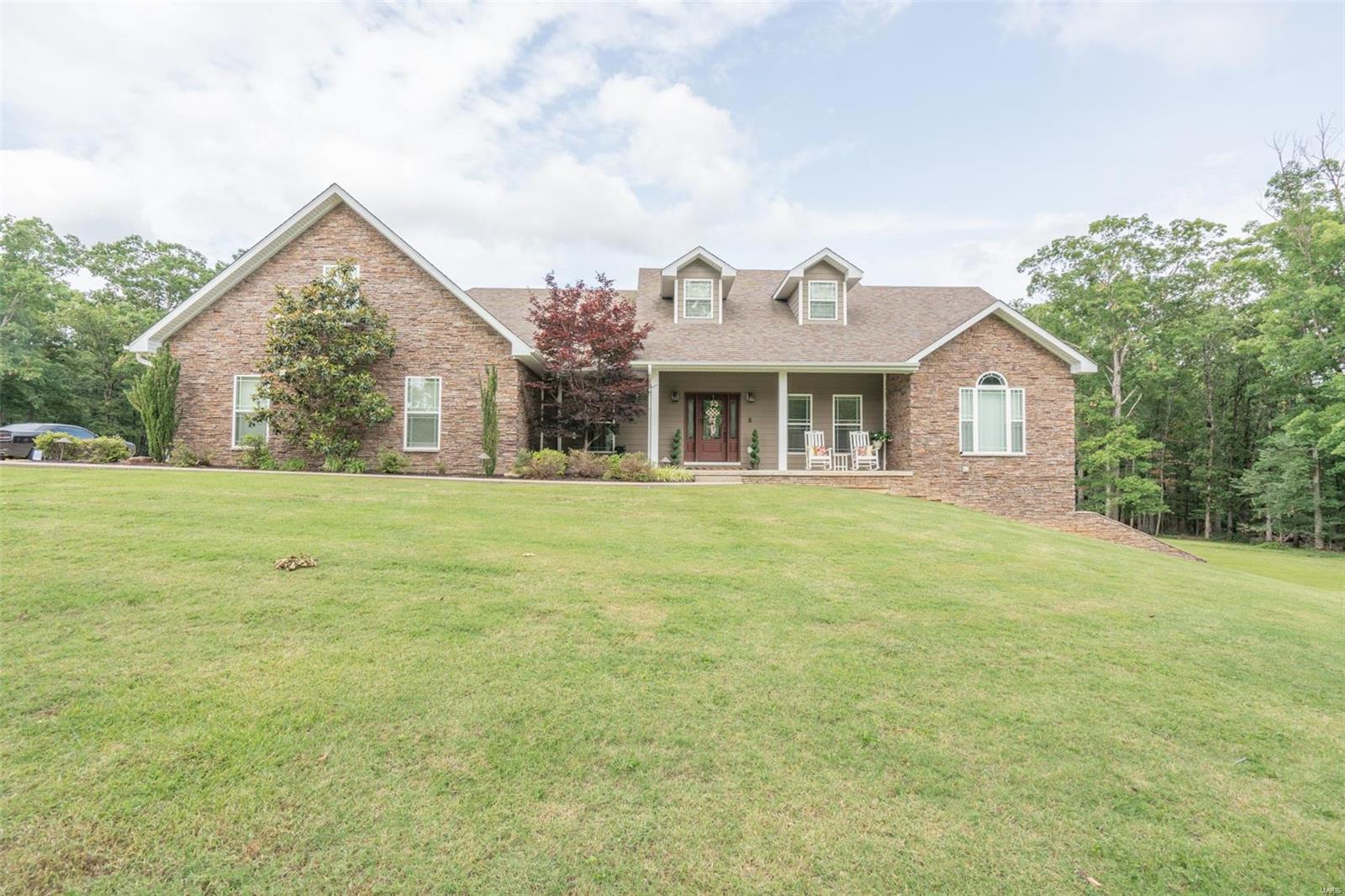 $767,000.00 160 Remington Pl. Poplar Bluff, Mo 63901; Prepare to be greatly impressed when you view this one!! This immaculate 5BR 3.5BA home in popular Remington Oaks was built in 2014, sits on 4.8 acres M/L & is full of wow factor and too many amenities to even mention! 9' ceilings on main & basement levels, very large kitchen with abundant cabinetry and granite counters, 19x8 laundry, cathedral ceiling in LR with gas fireplace, split floor plan with great master BR & master bath offering walk-in tiled shower and large closets. Covered deck off back will be one of your favorite places to spend time & it overlooks an amazing in-ground salt water pool with tons of patio area around pool for entertaining! 32x29 attached garage AND a 30x26 detached insulated shop with heat that all will love!! Basement offers a lg. 2nd kitchen with granite counters and dining area, lg. family room & 2 additional bedrooms, bath and large storage room with utility lawn mower garage! YOU'LL LOVE THIS HOUSE!