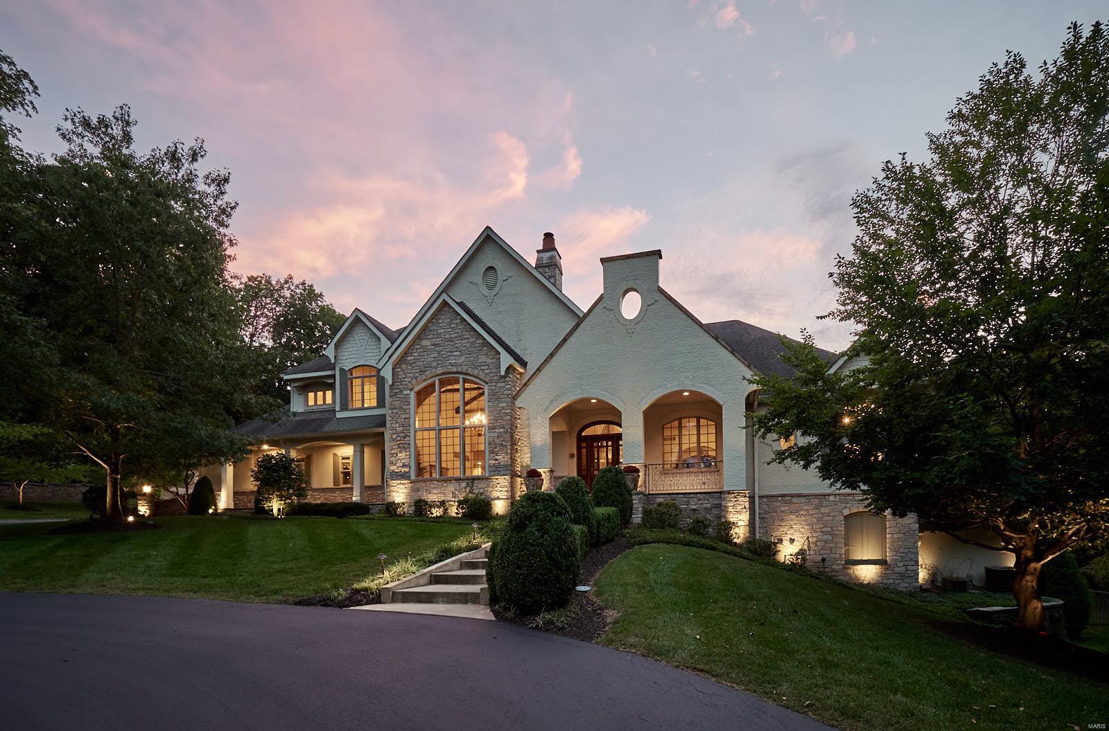 This remarkable 1.5 story estate on 12+- acres is tucked away in the most private setting. Previously built by a luxury home builder for their own home, no details were spared in the design and amenities. The master suite is a resort of its own with expansive custom his/hers closets, digitally controlled steam shower and soaking tub, and a vanishing TV in the mirror. Kitchens today are designed to serve as the center piece of the home, and this one does not disappoint. A 6 burner commercial stove, dual built in refrigerators, double ovens, and a furniture style island are a few of the highlights. The space flows right to the cathedral ceilings with rustic beams that adorn the great room. A massive walk in fireplace is patiently waiting for the cooler temps to set in. The lower level is like nothing you have seen before. A billiards, bar and TV area are quickly overshadowed by the basketball court with maple floors. The outdoors are enjoyed by the pool, barn, and extensive landscaping.