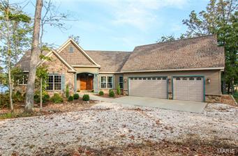 The expansive view of 236-acre Alpine Lake will take your breath away as soon as you enter this luxurious 4-bed, 3-bath fully furnished custom home. The great room features a gorgeous stone fireplace, soaring vaulted ceiling and gleaming hardwood floors. The kitchen is a cook's dream with its massive stone-faced island featuring a beautiful farmhouse sink and plenty of counter space, custom cabinets and stainless steel appliances. The breakfast nook and separate dining area allow you to enjoy scenic backdrops at every meal. Enjoy fresh air and lake vistas from the screened-in porch or deck. Wake up to the sun glistening off the lake in the roomy master suite with huge master bath. Two additional bedrooms in the lower level and large recreation area provide plenty of room for family and friends. All lead to a beautiful patio with pavers, gorgeous landscaping and gentle slope to the fabulous private beach area and fire pit. Geothermal heating and cooling add to year-round comfort. Additional Rooms: Mud Room