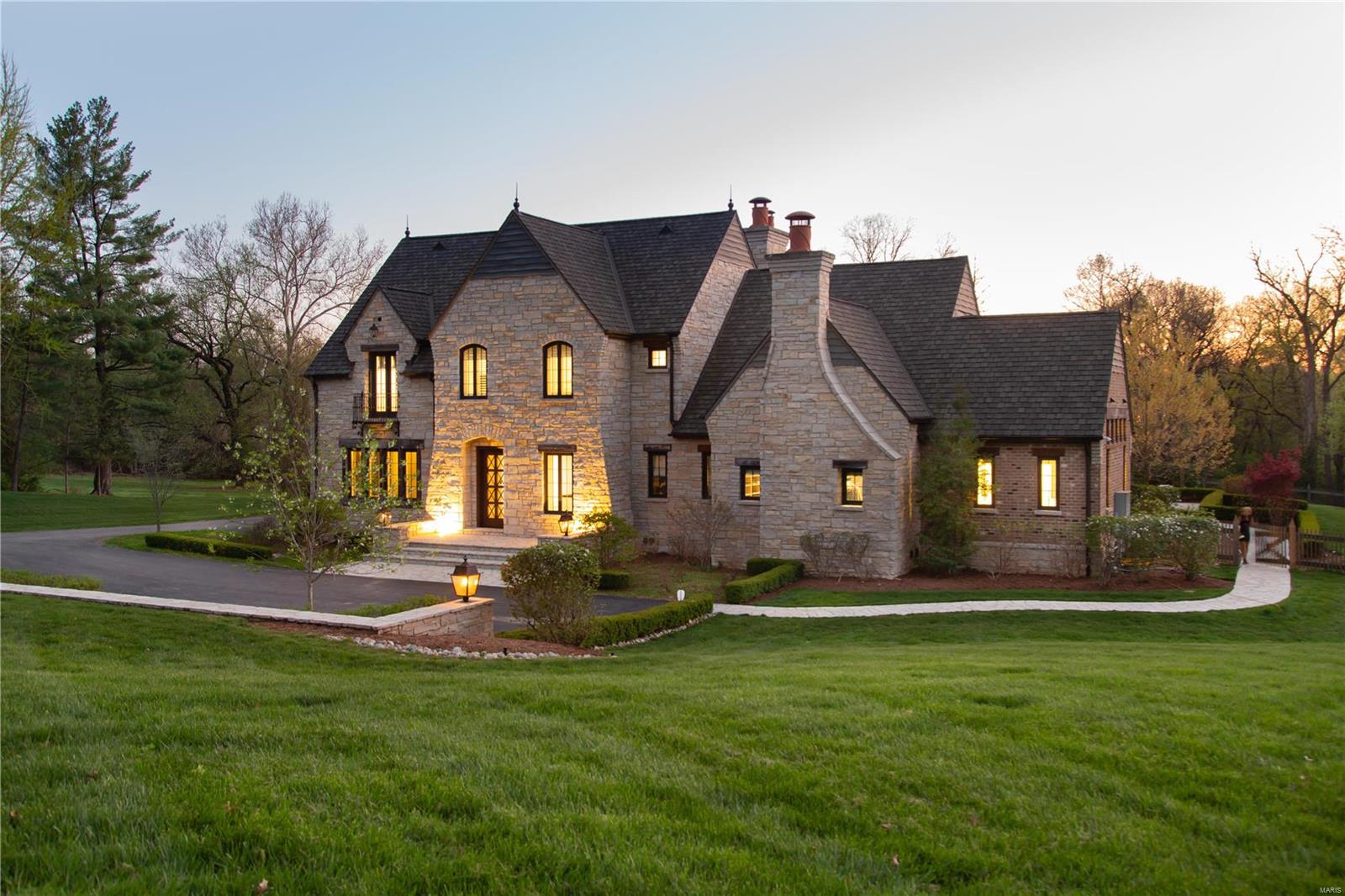 This exquisite custom home is a true masterpiece. Nestled on 3,2 acres, with extraordinary interiors, magazine-worthy outdoor space, this home was designed for comfortable daily life & lavish entertaining.  
The interior incl. fabulous floor plan & high-quality finishes. Sophisticated dining rm, chef’s kitchen w/an oversized walnut island, spectacularly detailed cabinetry, Sub-Zero/Wolf appliances, butler's bar; custom lightning, marble and oak flooring, expansive sets of French doors leading to the heated salt water pool with waterfalls, hot tub and impressive outdoor room with fireplace.
Hearth rm boasts btfl lime stone fireplace, wet bar & pass-thru window to outdoor area. 
Remarkable main level owner's suite offers 12' ceiling, wet bar, marble bath with steam shower & heated floor. 3 luxurious secondary bedrms with ensuite marble baths and a loft on UL.
Office on LL, 5th bdrm with private bath suite, home theatre, mini dance studio/gym, mini hockey rink. Heated 4 car garage. Additional Rooms: Mud Room