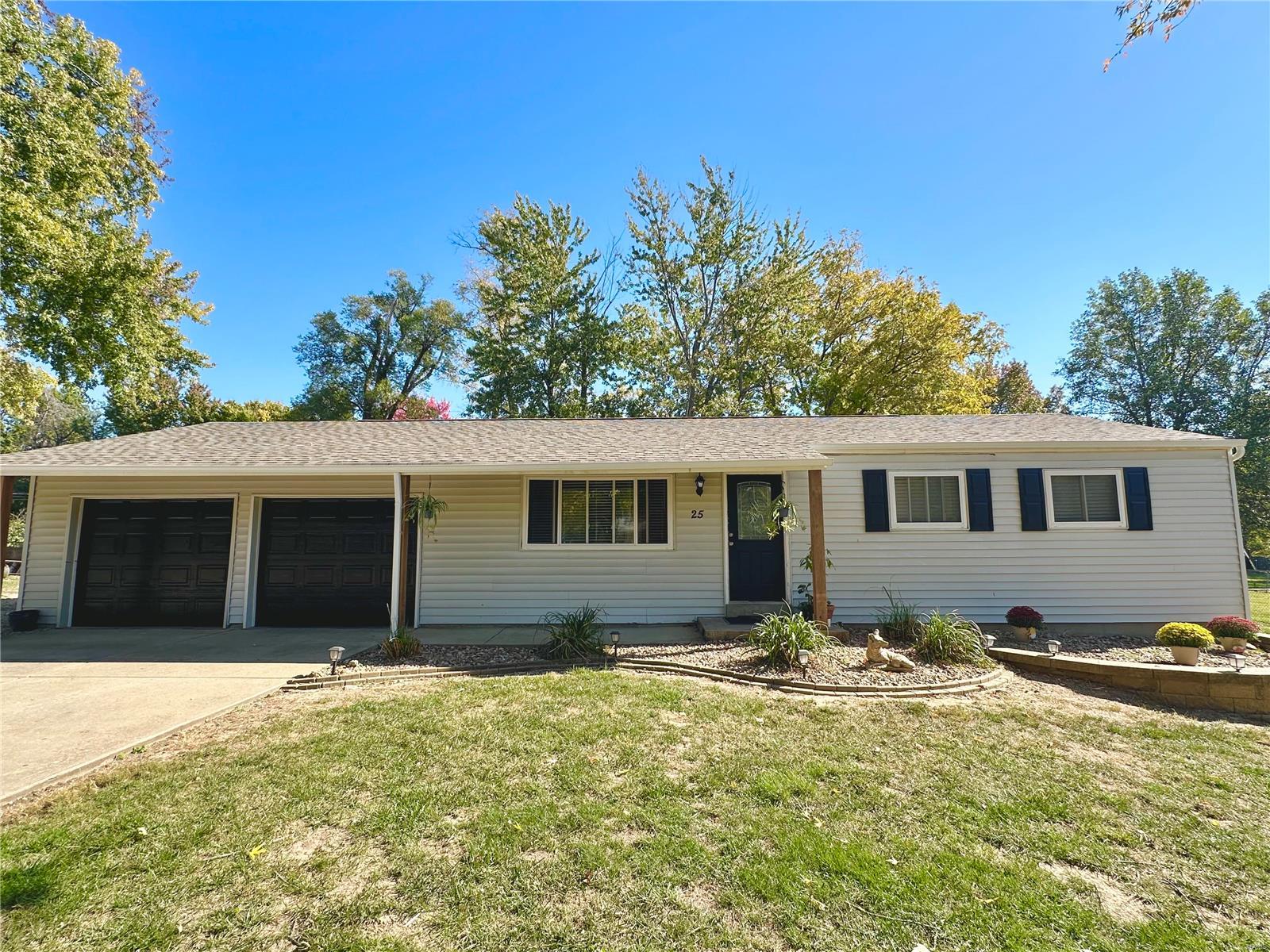 Rare Opportunity! Country/park like feel while still just being minutes from shopping/restaurants/schools.  This home sits on an amazing lot that is .62 acres and on one way in/out street in the heart of St Charles.  New Roof/Gutters/Downspouts Sept 2024, New AC unit June 2024, New Furnace June 2024, New Laminate flooring and fresh paint Sept. 2024. Kitchen features granite counters,  updated cabinets, laminate flooring and canned lights.  3 bedrooms all with wood floors, new doors and hardware.  Basement is a walk up that is super clean, wide open for easier finishing.  Garage is oversized.  Large paver patio with built in fire pit out back. Huge driveway with extra parking along the side that can easily accommodate multiple campers, boats, RV's, Trailers, etc.  Francis Howell Schools
