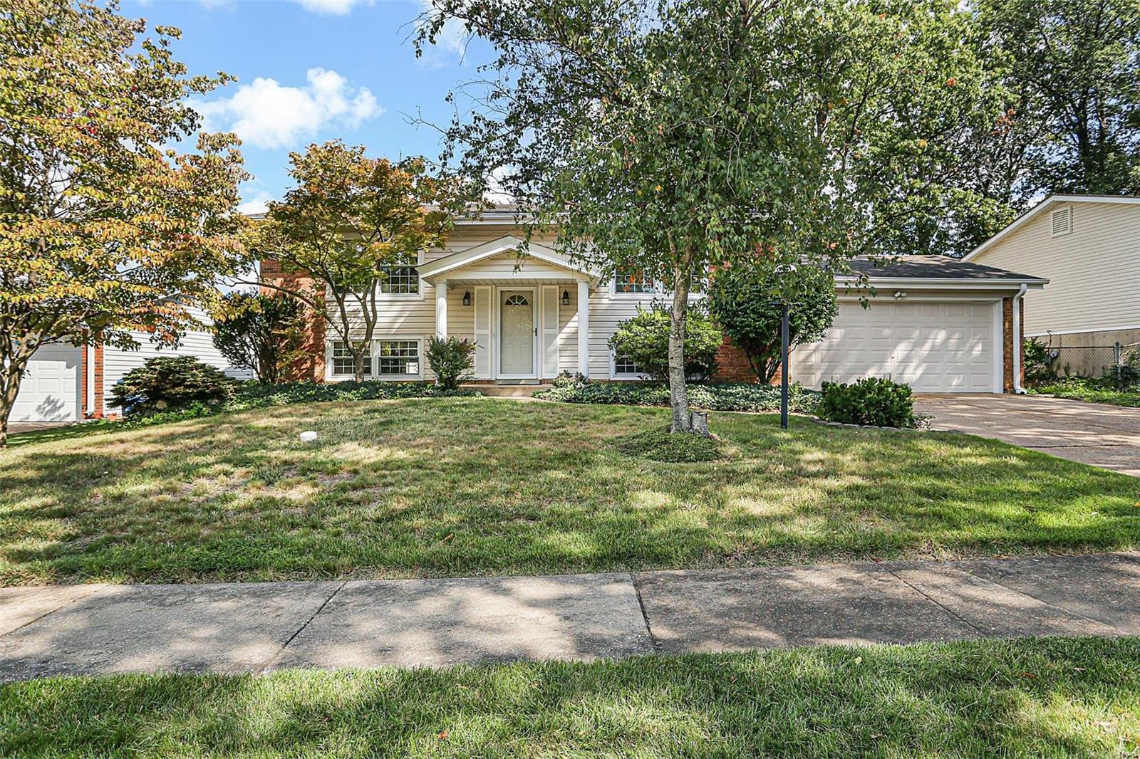 IMMACULATE! AFFORDABLE MOVE IN READY HOME IN PARKWAY SCHOOLS! 6 Rooms, 3 Bedrooms, 2 Full Baths.  Nice Street Appeal with Decorative Brick & Low Maintenance Vinyl Siding! 2 Car Garage with Concrete Driveway! Lots of Fresh Paint! Clean as a Whistle! Large Level Fenced Backyard! Updated Lighting, Six Panel Doors, Neutral Decor, Large Kitchen with Breakfast Area & Sliding Door to Deck. Large Lower Level Family Room has Walkout with Sliding Door to Patio. Hardwood Under Carpet on Main Floor. Roof, Gutters, Garage Door, Privacy Fence-2012. HVAC-2011. Thermal Windows. Washer & Dryer can stay as is. Dusk to Dawn Lampposts in Front and Back. ALREADY PASSED MARYLAND HEIGHTS OCCUPANCY INSPECTION.  Minutes to Westport Plaza-Walking Distance.  Maryland Heights Amenities.