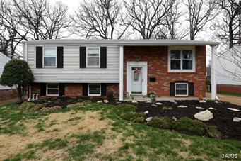 Great location, Kirkwood Schools, manageable in size and move in ready!  This 3 bedroom, 2 bath, open floor plan, home is inviting and well cared for.  The living room opens to breakfast area.  The kitchen is updated and neutral with newer appliances.   The master bedroom and additional bedroom/office/sitting room all have hardwood flooring and are located on the main floor.  The family room is light filled and spacious with a wood burning stove.  A full bath, 3rd bedroom, laundry area and plenty of unfinished space for storage, completes the lower level.  Other features include: level lot, newer roof and 1 car garage.