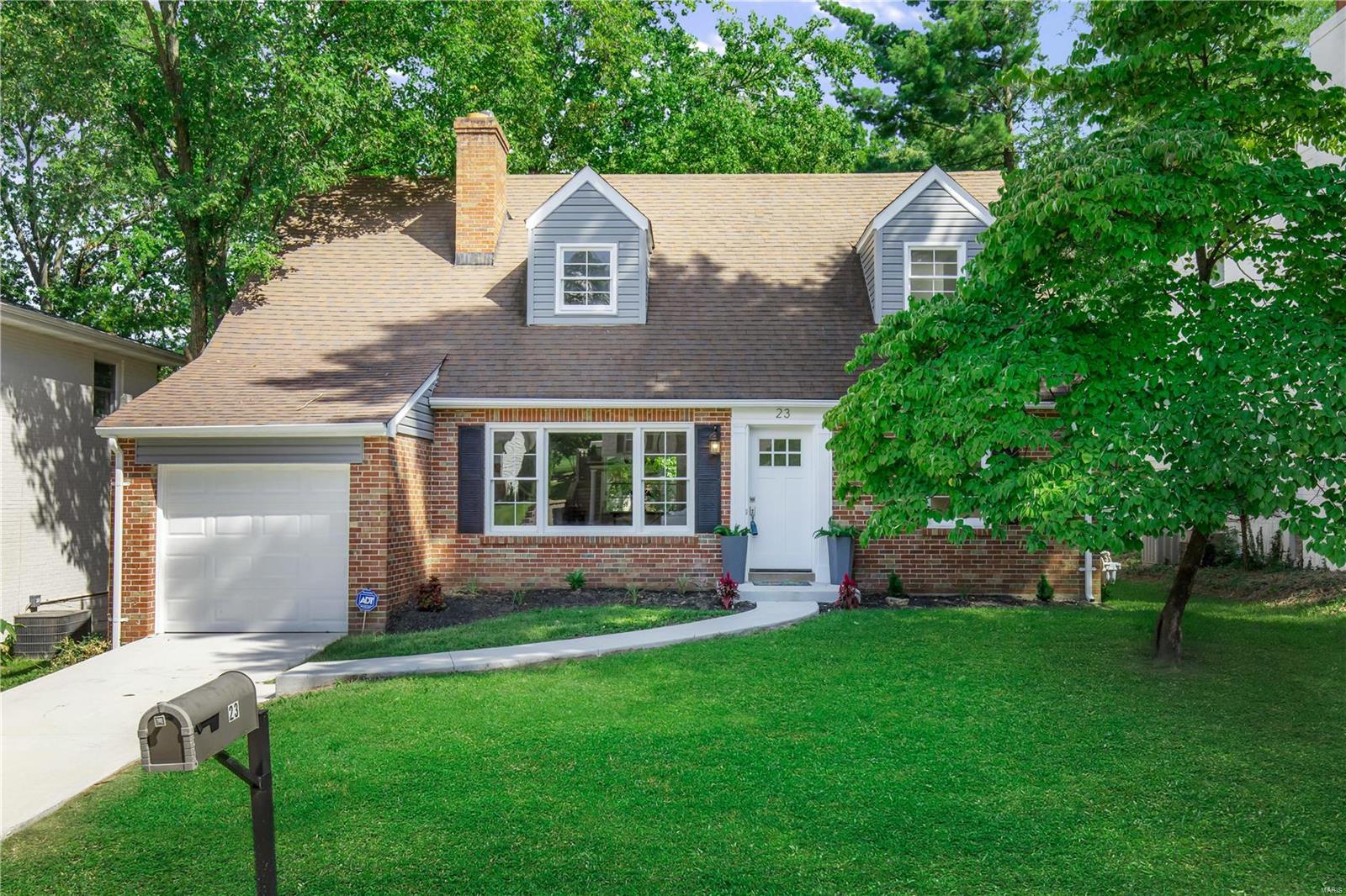 Completely updated 1.5 story home. Family room with wood floors and a brick surround fireplace. Updated kitchen with granite countertops, custom cabinets with crown molding, custom backsplash, stainless steel appliances, and adjoining breakfast room with wood floors. Main floor master bedroom. Additional bedroom and a full bath on the main level. Upper level boasts 2 generous sized bedrooms and a full bath. Upper level could be used as a master suite with a full bath and an office/nursery. Walk-out lower level. Freshly painted throughout, updated bathrooms, 2-panel doors, attached garage, level lot backing to trees, and more!