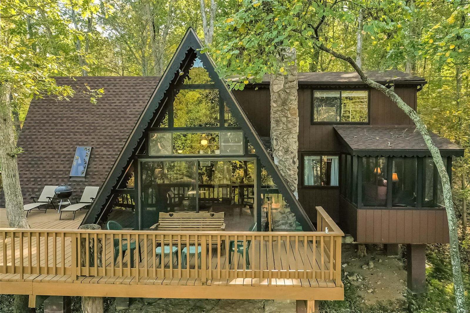 Check out this large, expanded chalet which includes 4 bedrooms, 2 full baths, vaulted living room @ dining/family room. This redesigned chalet is on one of Innsbrook's largest lakes, Lake Innsbrook...fun times to be had by all while boating, paddleboarding & kayaking to Corlina Beach. This light-filled chalet with open floor plan is perfect for entertaining family & friends. The main level opens to an expansive wrap around deck with panoramic views of the lake & wooded lot. The main floor features a large primary bedroom ensuite with private screened in porch. The loft is perfect to curl up with a good book and cup of coffee. The stone wood burning fireplace is ideal for a crisp fall day. While on the deck, enjoy the IBK wildlife, spring and fall colors. Take the path down to the dock to view the lovely waterfront shoreline @ access to the water. Not familiar with IBK? Check it out @ innsbrook-resort.com. Includes most furniture. Accessories & some dishes excluded. See Agent Remarks.