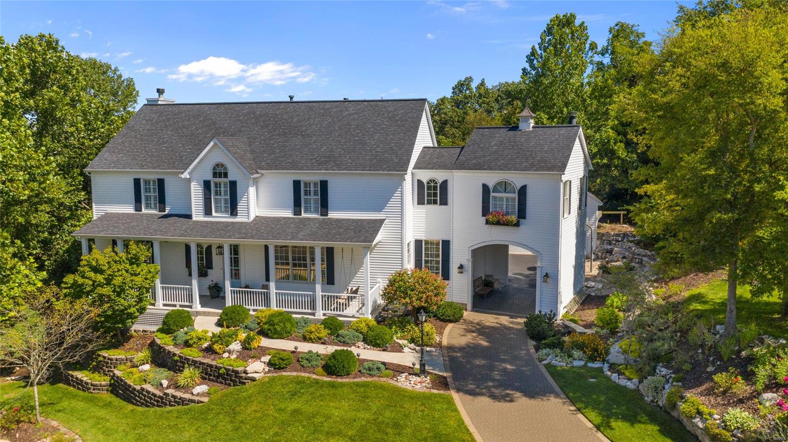Absolutely stunning home conveniently located in Oakville! With over 5700 sqft of living space and classic, high end finishes throughout, this home is a rare find that's sure to impress. With a wooded 1.37 acre lot, and a "porte-cochere" style paver driveway leading to the 3 car garage, this home is especially unique to the area. The main floor features hardwood floors, wainscoting, 10' ceilings, and plenty of space for entertaining. The kitchen comes with custom cabinets, high end appliances, marble countertops, a breakfast nook, pantry, and massive center island. The main floor also features a formal dining room and two sitting areas each with their own fireplace. The spacious master suite features a fireplace and walk-in closet. The home not only has a large porch and timbertech deck, it also has an amazing backyard made for summer pool parties and barbecues. The finished, walkout basement features a kitchen, bedroom, bathroom, and living area. You do not want to miss this one!