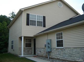 Large two bedroom townhome in pristine condition. Newer construction, open floor plan, large rooms, main floor laundry, walk-in closets, oversized one car garage, private deck, wooded view. The complex is only 4 years old and is located on a private cul-de-sac street just off Highway A and Highway 55. Convenient to shopping, highways, parks and entertainment. This is a great location.