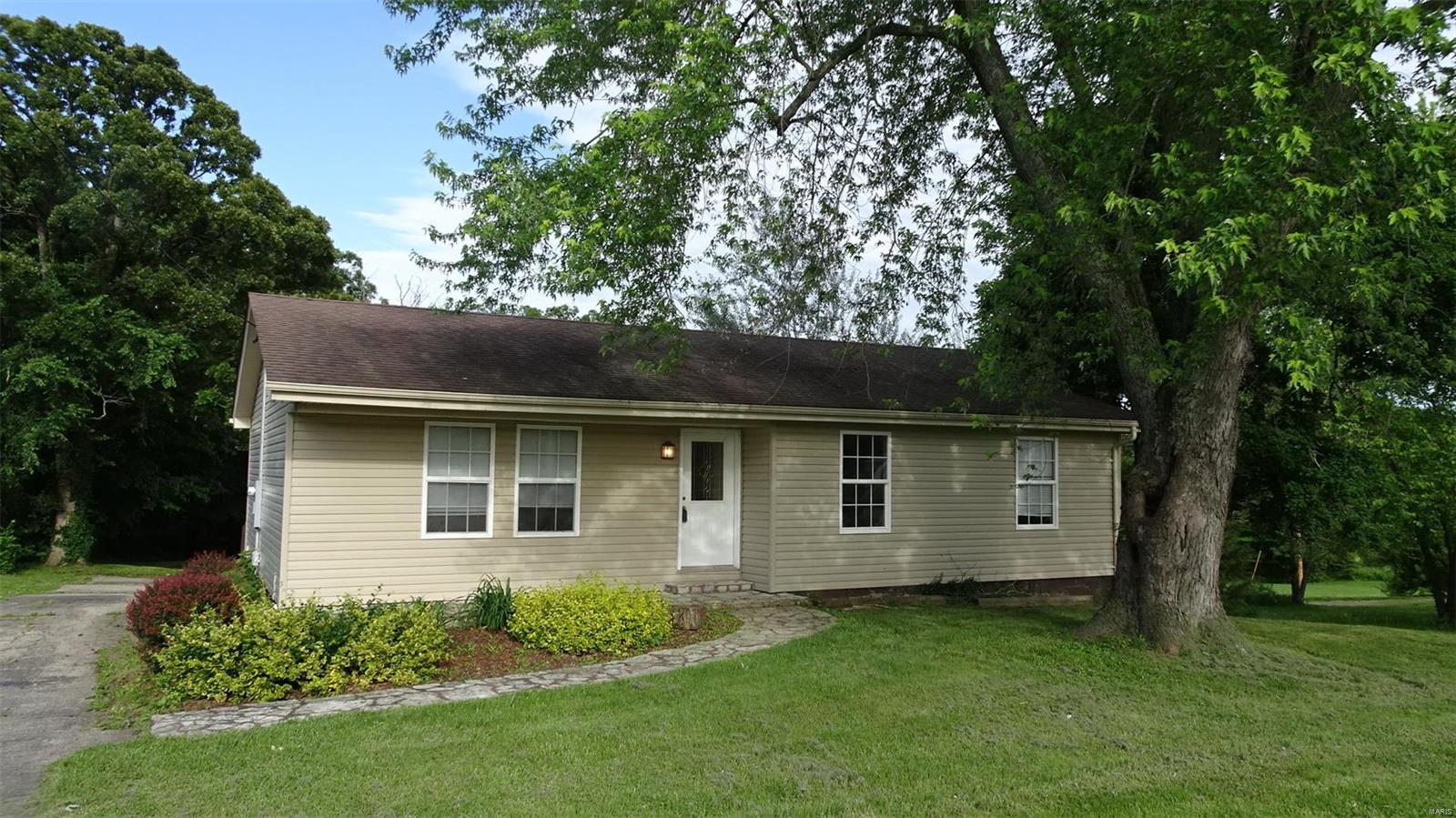Updated septic system, new motor and other repairs within last 3 years.  Front basement walls have some cracks, some leakage.  Rear entry basement garage.  Hardwood floors in living room.  Tiled floor kitchen and baths.  Almost 1/2 acre lot.  Front ditch reworked. Water heater replaced recently.