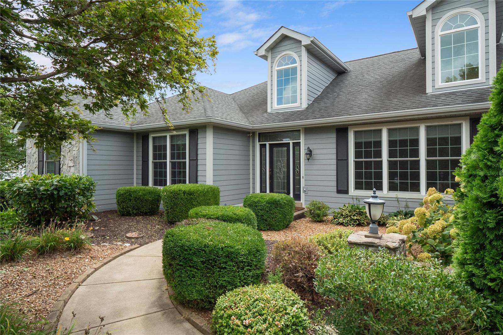 Welcome home! Curb appeal, location & abundant entertaining spaces (both indoor & out) make this home a catch! Inside, the spacious main floor plan includes: dining room, home office, sunroom, beautiful great room, eat- in kitchen & THREE bedrooms. A mixture of artfully lain hardwood, porcelain tile & carpeting abound. The kitchen is a chef's delight, with double wall ovens, a gas cooktop & storage galore. The arrangement of rooms in this home is extremely functional, with the laundry room just outside the primary bedroom suite and near the other two supporting main floor bedrooms (complete with their own Jack-n- Jill). The finished basement, ABUNDANT with windows is just the start of the downstairs entertaining spaces! Bar, movie/ lounge area, gaming area, gym space, TWO bathrooms & a bedroom! Moving outdoors to sip your favorite drink at the pool OR hot tub will be a breeze. View the beautiful pool waterfalls & landscaping perfection or catch fish in the shared lake. Additional Rooms: Sun Room