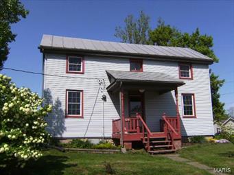 CHARMING OLDER AUGUSTA HOME WITH 2-3 BRS (Living room could be converted to main floor BR), 24'x 40' 3 CAR DET. METAL GARAGE/WORKSHOP w/concrete floor & 200 amp elec. service. Home retains MANY ORIGINAL DETAILS, but has UPDATED CONVENIENCES.  NEW OAK KITCHEN CABINETS (2012), NEW MAIN WATERLINE FROM METER TO HOUSE (2011). APPLIANCES INCLUDE FRIG, GAS STOVE (2011), DW (2012). Additional updates include vinyl siding, almost all replacements windows (2 original windows on upper level), 100 amp circuit breaker panel, PEX flexible plumbing, tankless water heater, updated bath w/ clawfoot tub & shower attachment & hook-ups for a stacked washer/dryer in bath, water softener, whole house ventilation fan, ceramic tile floors in kitchen & bath.  Circular concrete driveway with patio area. Located in HISTORIC AUGUSTA, walk to Katy Hiking & Biking Trail, elementary school, library, wineries, brewery, restaurants, shops & more.  ENJOY NEARBY MISSOURI RIVER ACCESS at St. Charles County Klondike Park.