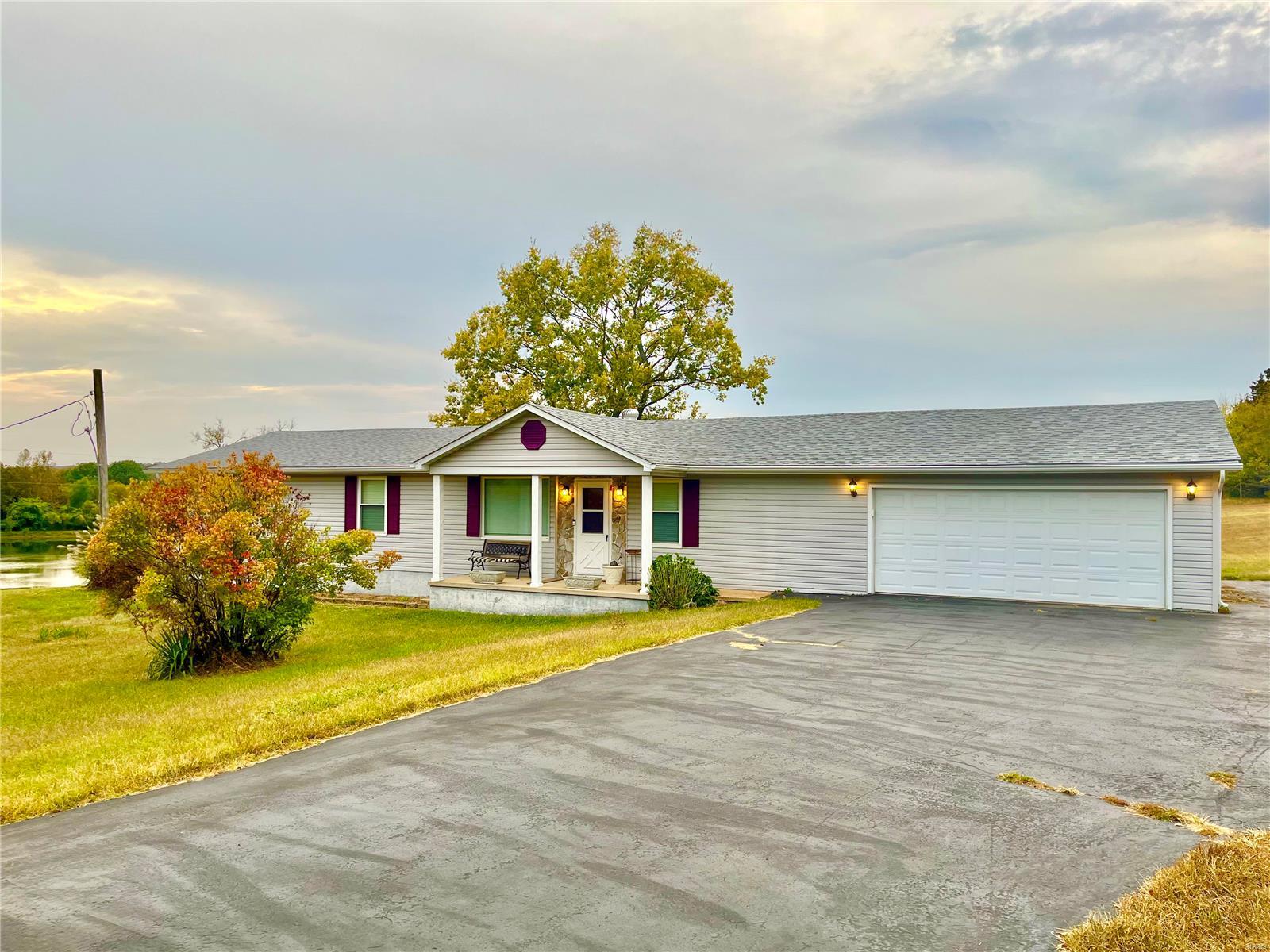 Absolutely beautiful home! You will love the peaceful almost 2 acre large level yard! Sit on your covered 24x13 patio and enjoy the view! Many updates including newer Roof, AC, Water Heater, newer updates on septic system almost all completely updated, newer updates on well system. 3 bedrooms with seller willing to install a closet in 3rd bedroom upon your request in your offer. With the quality of construction You will be surprised that this home was originally a mobile home that was added onto. Amazingly large attached garage is 25x24 and is ready for your vehicles or your toys, area along side the house would be perfect to park a boat or RV! If you are looking for a place to enjoy that is  big enough to entertain your family and friends....you have found it here! This is a wonderful home that to see is to love!   Seller increased price due to Seller is upgrading the electric system. Back on Market seller obtained info from Jeff co regarding septic and had electrical work completed.
