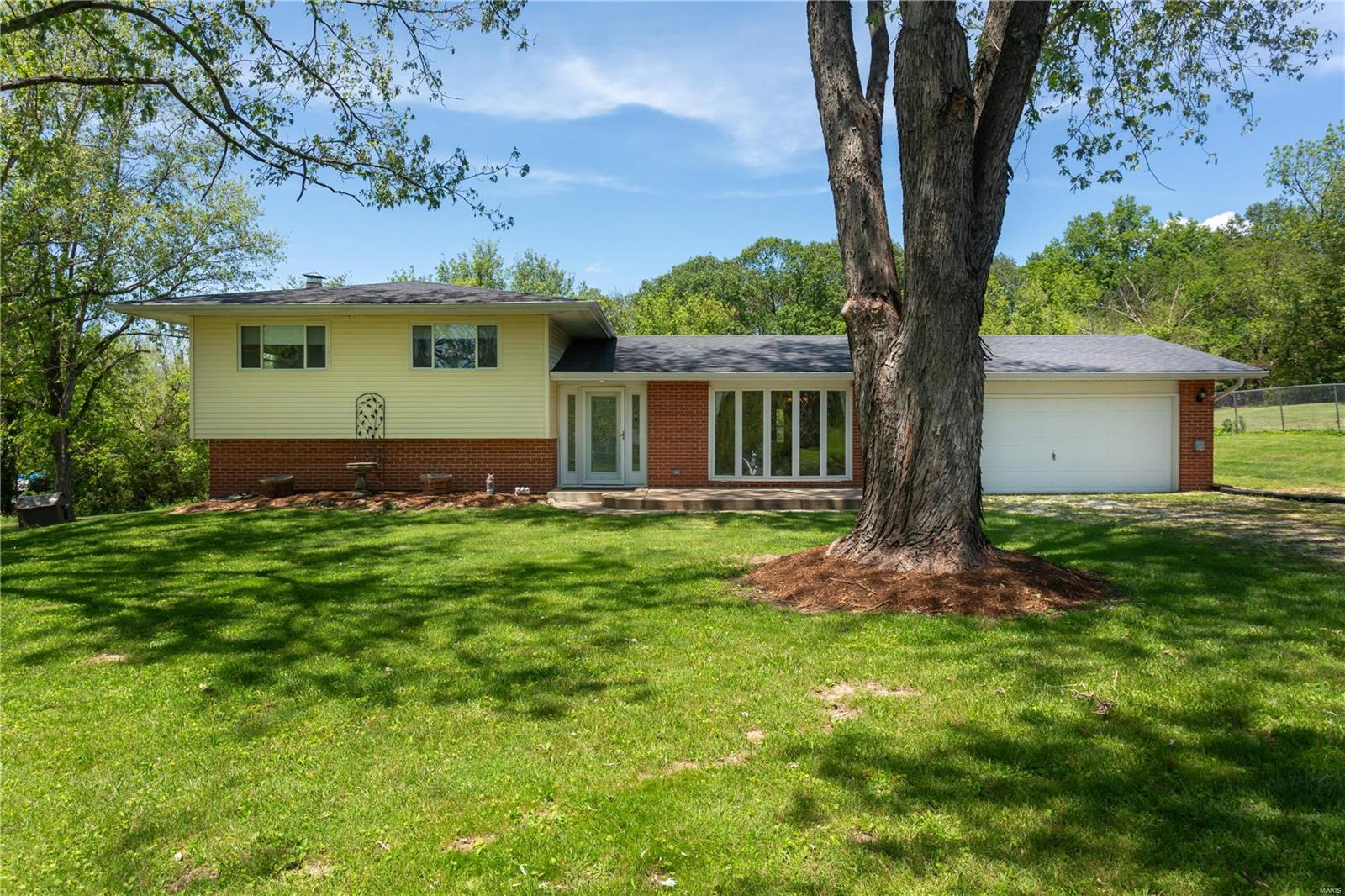 This home has so much to offer! It is a 3-bed, 2.5-bath large tri-level that is on more than 1.5 acres. There is ample space with over 2,400 SQ FT of living area, spacious 2-car garage, and a 30x24 metal outbuilding to store your vehicles and toys. You will love the amount of cabinetry in the kitchen with the Cambria Quartz countertops and backsplash! Are you looking for a place to entertain and enjoy your coffee on a nice sunny morning? Do not worry there is cozy concrete patio in the back looking at the woods! The home is conveniently located off Old Highway 21, right by Highway 21, and Highway A. Close to shopping, great restaurants, parks, etc. Don't miss this opportunity in the Hillsboro School District!