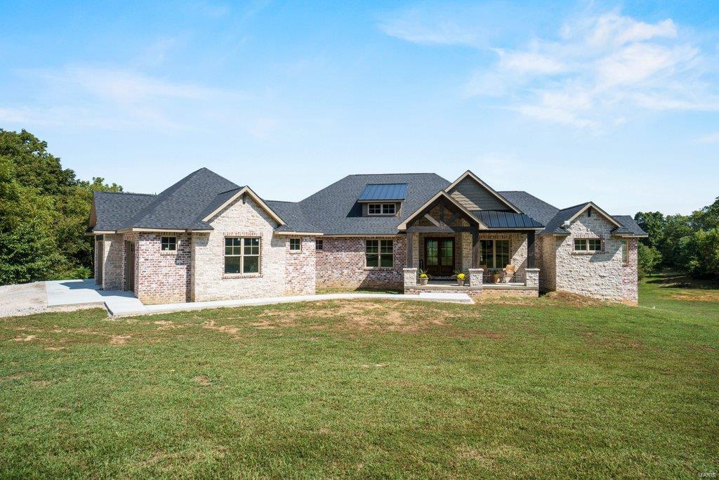 The floor plan is perfect, the finishes are impeccable, the style is trendy yet classic and the view and private land will fill all your heart desires! Custom built brand new home on acres 8 acres! 6,000 square feet that welcomes you with vaulted & timber ceiling front porch drawing you inside carrying the vault into the living space then out the back & straight into that view! Every detail is thought out - GORGEOUS designer style custom cabinets in laundry, quartz & built ins everywhere. The master suite has THAT view with an ensuite bath that is out of a luxury magazine. Full finished basement with family room, game room area, additional bedroom/bath, also has 1/2 bath located perfectly for a future pool location. Property has a fully stocked pond you can fish & kayak on, plus a barn. No covenants on property and EXACTLY 20 minutes to Target! Driveway and sidewalk will be completed this week. Additional Rooms: Mud Room