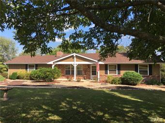 What a beautiful setting in this very quiet & quaint subdivision. There is privacy galore & lots of beauty surrounding the home located almost in the center of this 3.3 acre parcel. From the moment you drive onto the property you will appreciate the paved driveway, lots of landscaped areas, & the detached garage just back of the house/property. This is truly a property with loads of potential for the play ground, swimming pool, gardens in multiple locations, room for the children, pets, ATV's and so much more. Inside the home you will immediately notice how fresh and clean everything is. The 3 bedroom ranch style home offers 2 full baths, formal living room, dining room, sitting/office/den area, large kitchen, covered back deck & a bonus room where the original garage was located, and now offers a 24 X 21 recreational/family room. The home offers more than 1870 square feet of quality finish. Many of the features of the home have been updated/replaced, including the roof just this year.