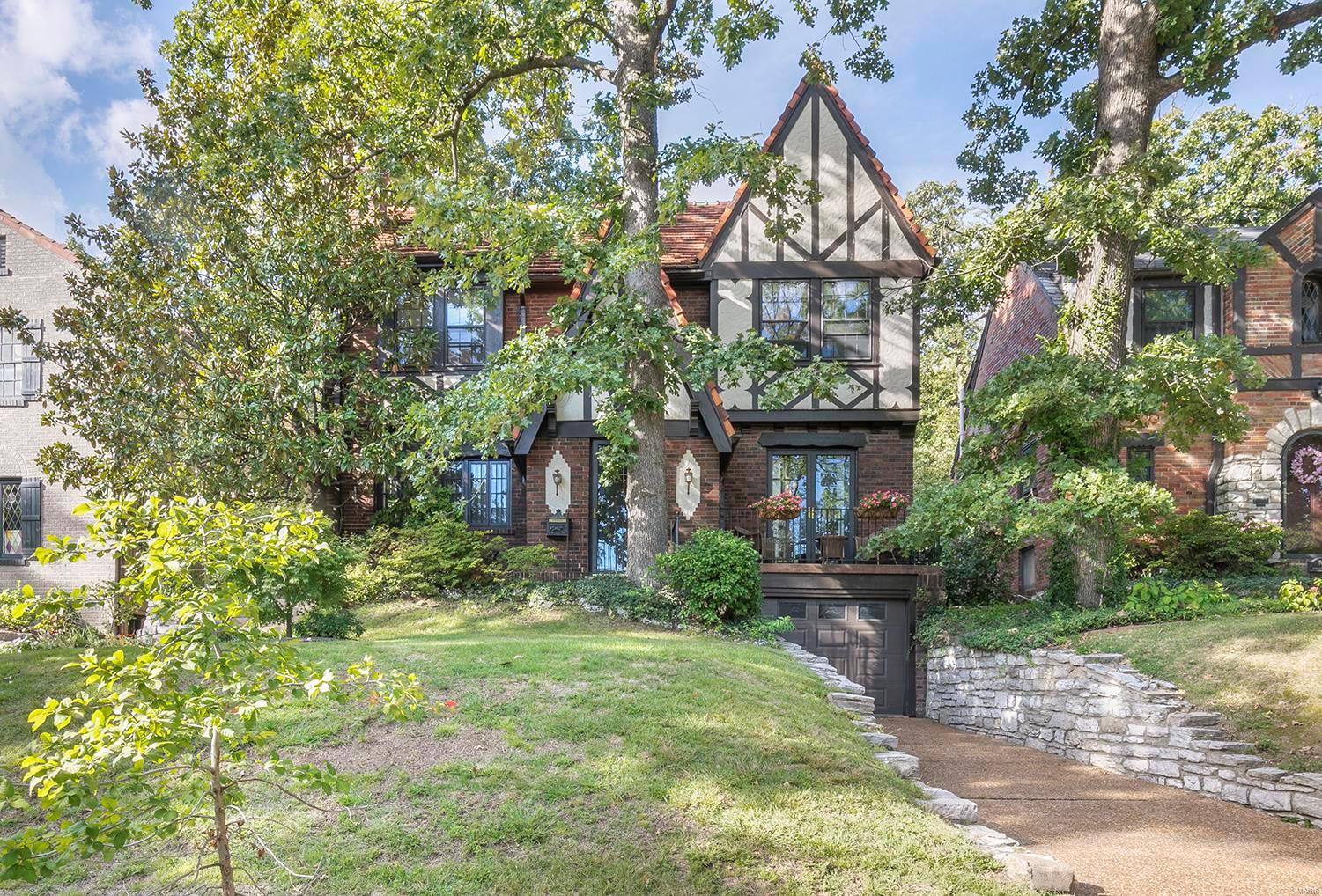 This beautiful 2.5 story Tudor-style home located in the heart of the Alta-Dena Subdivision features over 2500 sq. ft of living space, 4 bedrooms (with a 5th possible on the 3rd floor), hardwood floors throughout the main and 2nd floor, a beautifully updated kitchen with a brand new stainless refrigerator, gas range and microwave as well as beautiful new granite counter-tops and lots of storage.  The front door opens on to a large living room with a wood-burning fireplace and an adjoining sitting room with french doors to the quaint front balcony in the front.  The large dining room opens to back patio and landscaped backyard.  Upstairs, the child's bedroom is directly adjacent to both the hall bathroom and master bedroom and has the potential to be converted into a large master bathroom and additional closet space.  The amazing location is just a short walk to downtown Clayton, the Loop, Washington University and Flynn Park. Additional Rooms: Sun Room