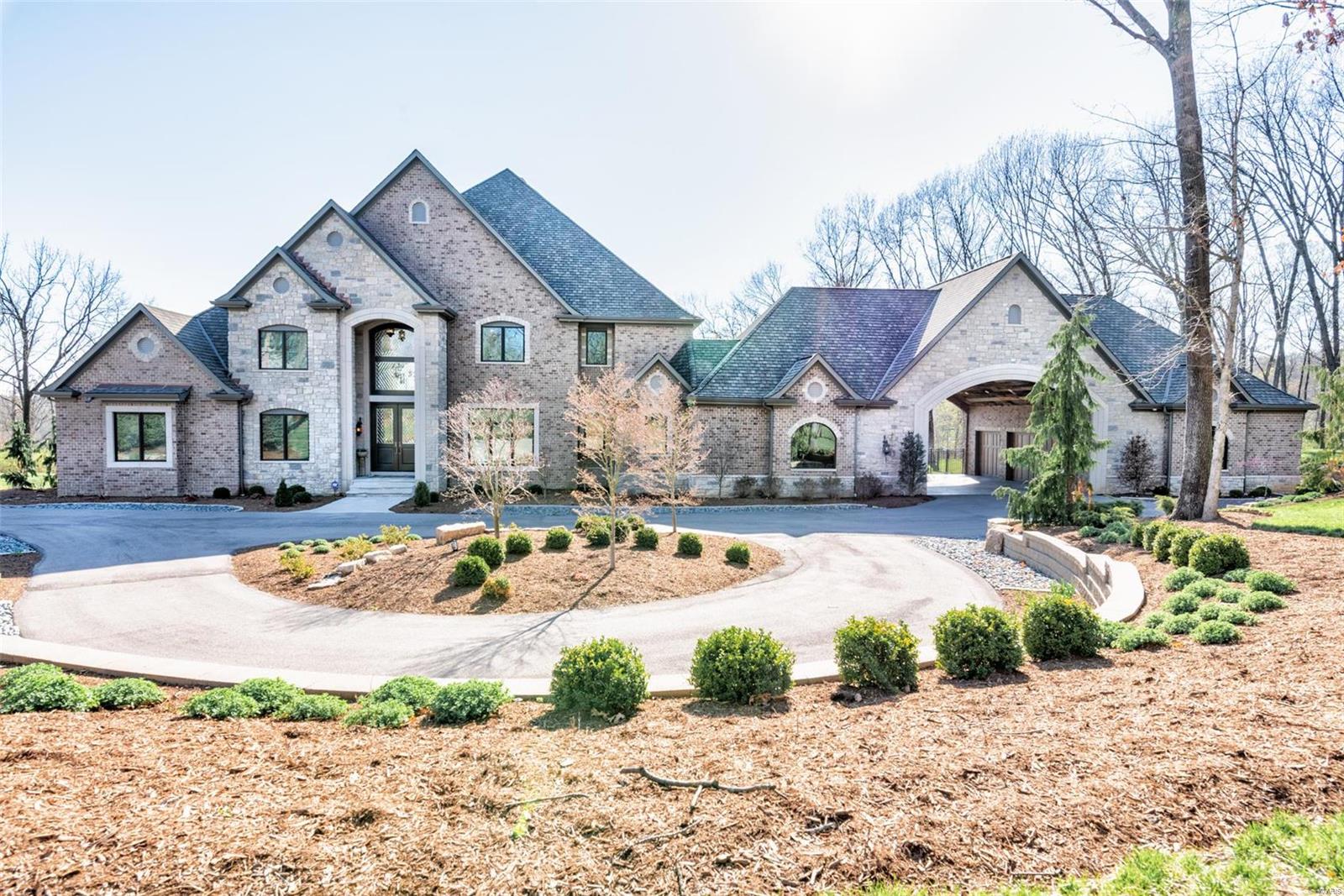 Stunning 4 Bed 7 Bath estate on 3.49 acres in Huntleigh. Features throughout: 10'+ ceiling heights, exotic grade granite, California Closets, 8' solid core doors, open floor plan, walnut floors & 4 gorgeous fireplaces. Control-4 operated Smart Home - lighting, AV, heat, garage doors & security.  Sub-Zero & Wolf, appliances. Exquisite Officine Gullo range.  Lower Level bar-2 big screen TVs, Subzero bev center, 2 beer refrigerators, ice maker, dishwasher drawers. HVAC ultra-quiet, high efficiency, dehumidifier & humidifier. Two 3-car, heated garages. Custom mahogany front & wine cellar doors w handmade beveled diamond glass. 3 laundry rooms, custom 1200 bottle wine cellar w chiller. Vault/Safe Room w 12” concrete & fireproof door. Gunite pool & spa w swim up bar, 2 fire bowls & waterfall. 22' outdoor pavilion w full kitchen-Subzero fridge, Wolf grill w rotisserie, ss storage, sink & ice maker. Custom A/V system-pool sound system inc 14 h-ifi speakers & 3 inground subwoofers. Additional Rooms: Wine Cellar