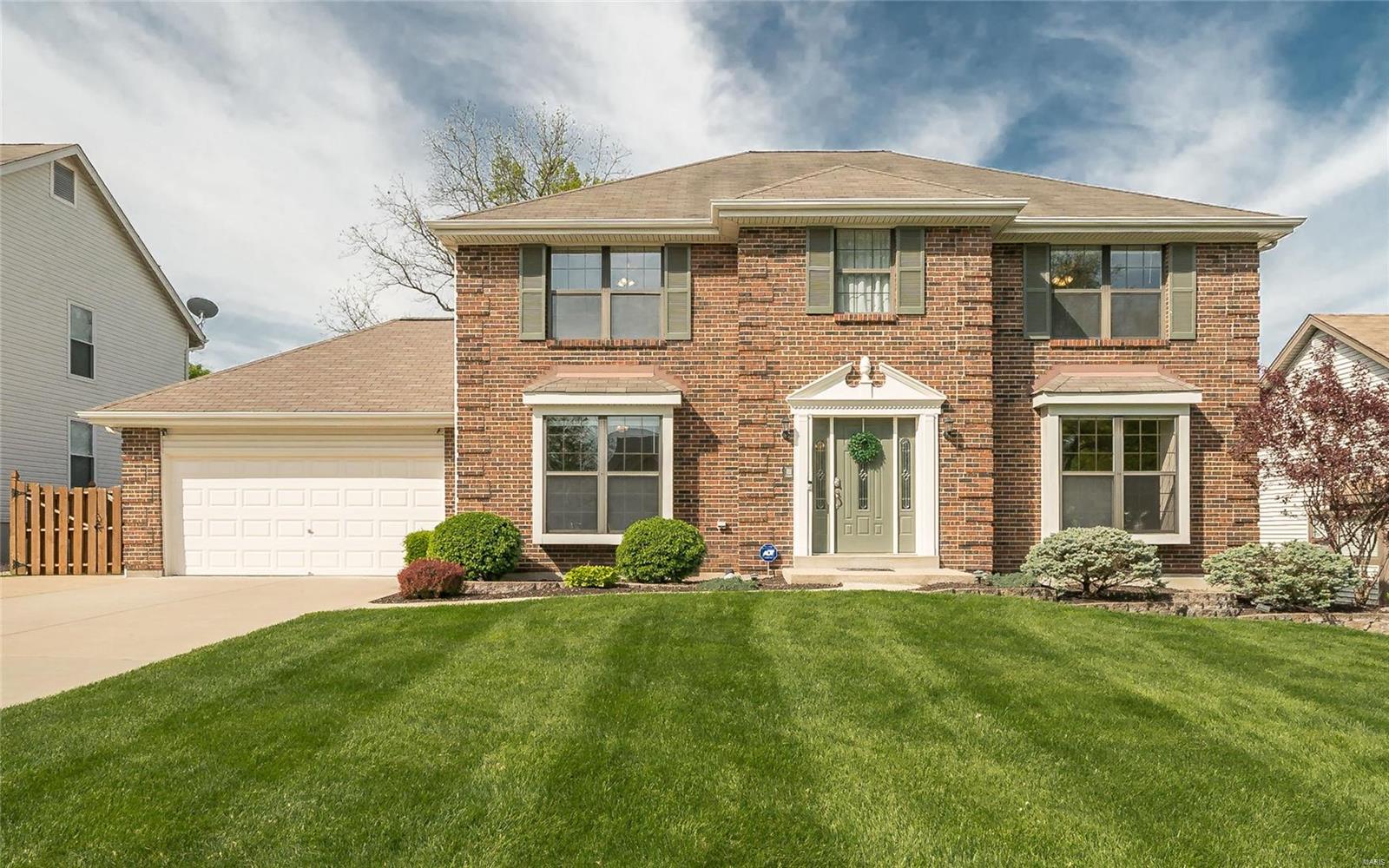 OPEN HOUSE MAY 9TH 12-2PM...SIMPLY AMAZING! GORGEOUS 4 BR, 3.5 Bath Featuring over 3200 Sq Ft of Living Space 3/4 BRICK EXTERIOR, IN GROUND SPRINKLER, LUSH LANSCAPING & LARGE PRIVATE FENCED YARD BACKING TO TREES! 3rd Car Bay Garage perfect for Workshop/Storage! Minutes from shopping, Highways & KATY TRAIL! Formal Dining Rm, office, Great Rm with bar, and Fireplace. Large eat in kitchen is open to the large family room, w/fireplace  IDEAL FOR ENTERTAINING/FAMILY GATHERINGS! Beautiful Hardwood floors on main level, Upgraded Doors & custom Trim throughout. Kitchen features Raised Panel Cabinetry w/Crown, Lots of Counter Space, stainless steel Microwave, Dishwasher, Range & Refrigerator. Dual Sliders offer access to a Large Patio w/Retractable Awning & flat Picturesque Yard. Upstairs Primary Suite w/His & Her Closets, Primary Bath w/Soaking Tub & Shower, & 3 more bedrooms with large closets. Finished LL with custom built desk, Family/Rec Rm and full Bath. New roof to be completed 5-5-2021. Additional Rooms: Mud Room
