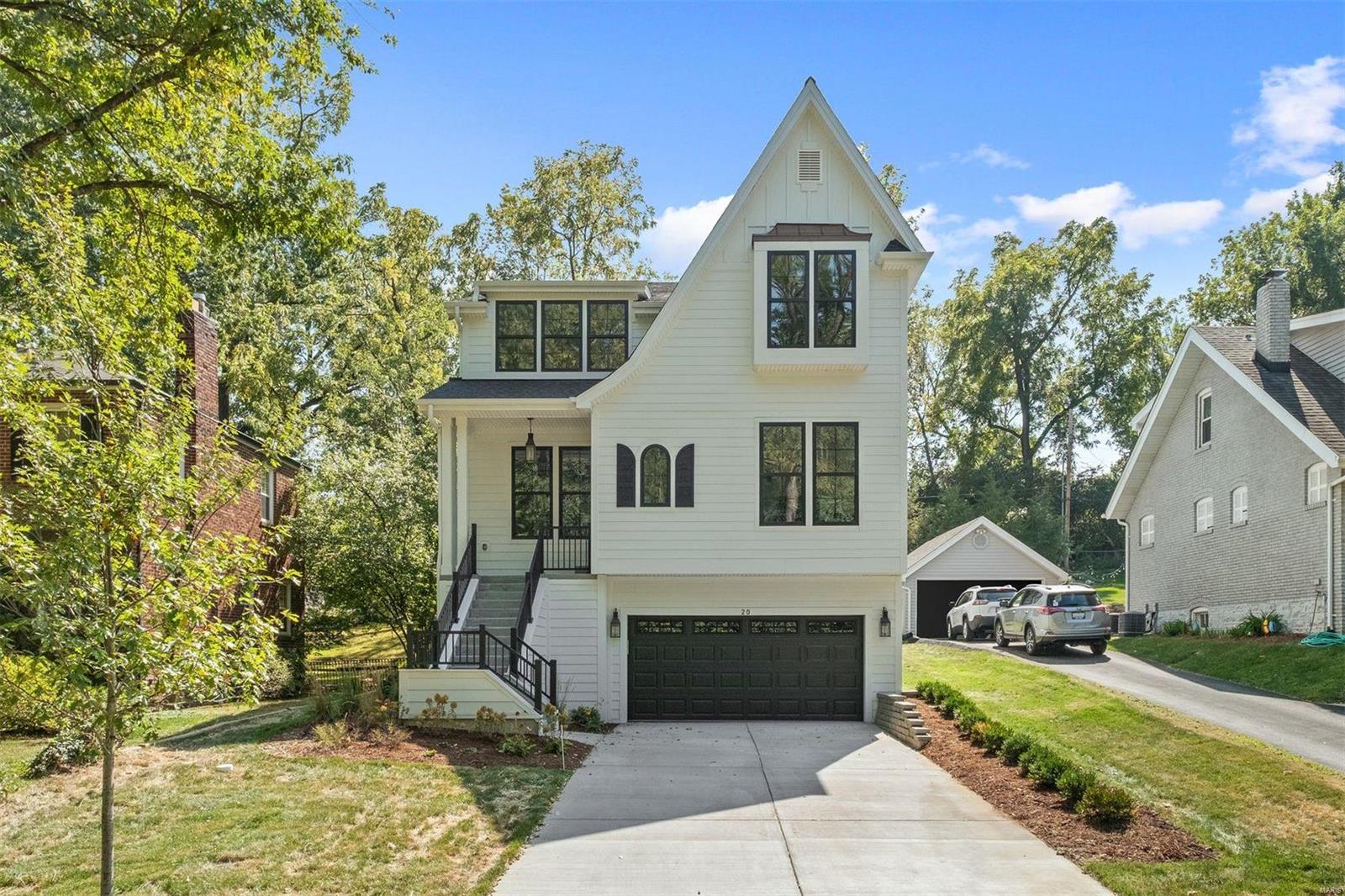 Sophisticated & stylish new construction home ready for occupancy in Ladue Schools. This gorgeous 5 bedroom/4.5 bath, open-floor plan, w/ wide plank hardwood floors, soaring ceilings, home office, upscale dining room, cool light fixtures, tons of high-end touches, & boasts over 5,200 sq. ft of living. The kitchen is a dream w/ center island, custom cabinetry, deluxe high-end appliance package, including a Wolf range, 3 ovens, built-in coffee machine, beverage center, warming drawer, & 3 Subzero refrigerators (1 on each floor.) Built-in dumb waiter brings your groceries to your pantry for extra convenience. Upstairs, find the primary suite w/ luxury bathroom, pattern tile floor, Carrera marble countertops, wainscoting, large dressing area w/built in coffee bar, & 3 add'l bedrooms ensuite & jack n jill bathrooms w/ custom tile work. The LL is complete w/ large rec room, bar, workout room, bedroom, & full bath. Brought to you by the award-winning custom home builder, Manlin Custom Homes.