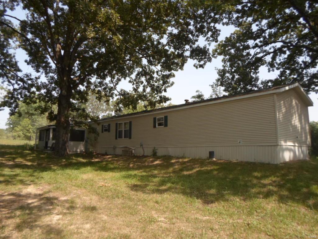 Looking for that Lake property close to 3 Wappapello recreationial areas. A country setting in this nice, 3 bedroom, 2 bath mobile home with 2-18x20 carports and a 12x10 shed with wood floor. There is a screened in porch & nice view of pond for your relaxing pleasure.