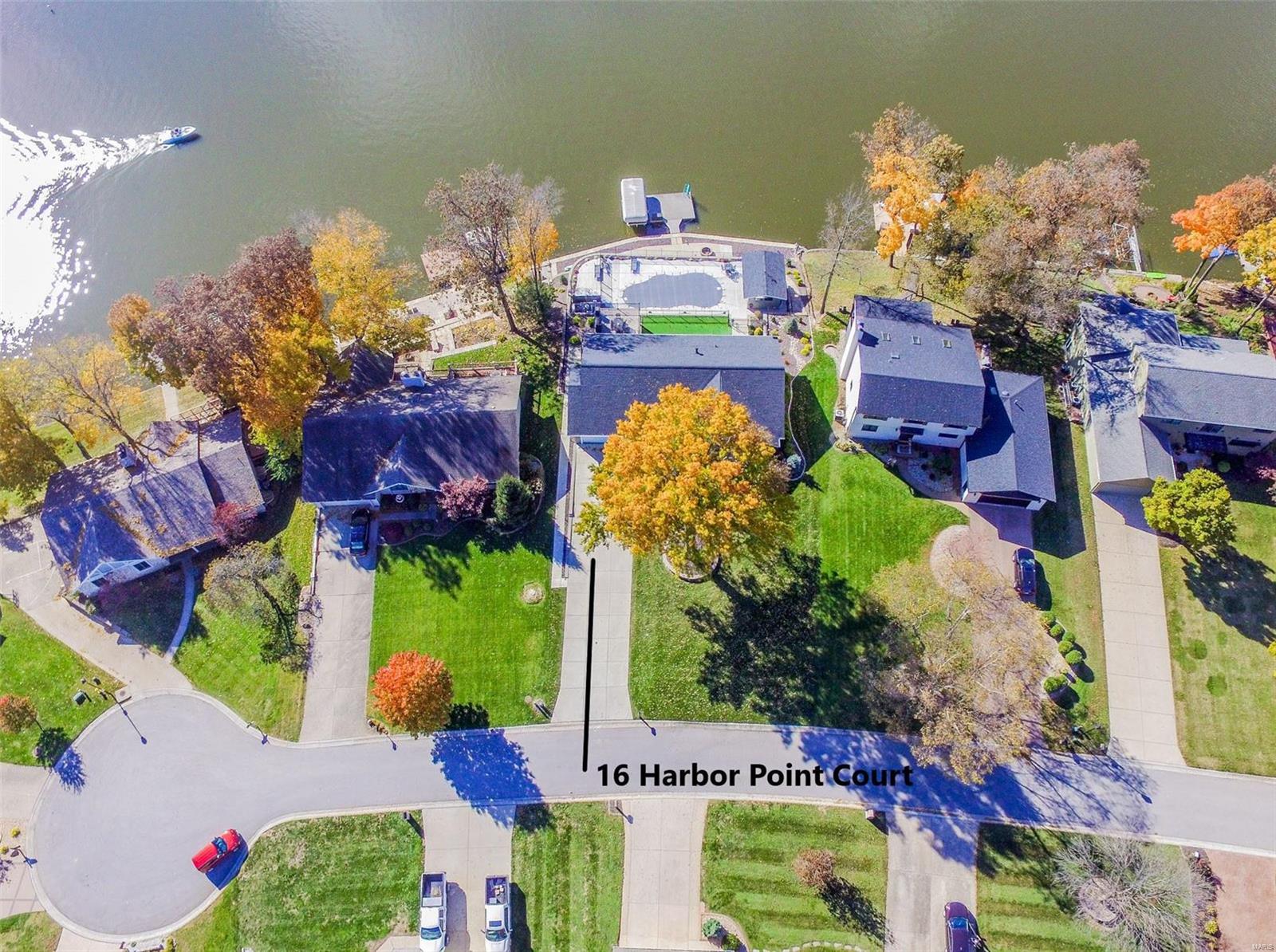 This Great Room Ranch Home was rebuilt down to the studs inside & out in 2016 & 2017. This like new waterfront home will be everything you've ever wanted. Heated & Cooled 34x16 Pool with Baja Tanning Shelf & a Cabana Outdoor Kitchen. It's truly a PRIVATE RESORT in the infamous no wake sunset cove with a main channel view & easy access to the main lake. Enter through the beautiful front door into the foyer leading into the open vaulted great room with a wall of windows overlooking sunset cove. Interior features a custom kitchen, 5 ton HE HVAC system, 20 Seer HE AC w/humidifier, 80 gal HE WH, 400 Amp electrical service, a laundry room on each level. There's 105 feet of shoreline that offers a new concrete seawall in 2020. There is a 52 ft. long water's edge concrete patio with a built-in firepit. The large 20x16 maintenance free Gorilla deck offers a waterproof floor and below is the 30x16 screened porch with a hot tub for 8. There are 2 TV's outside & surround sound stereo and security. COOL: 14 SEER+